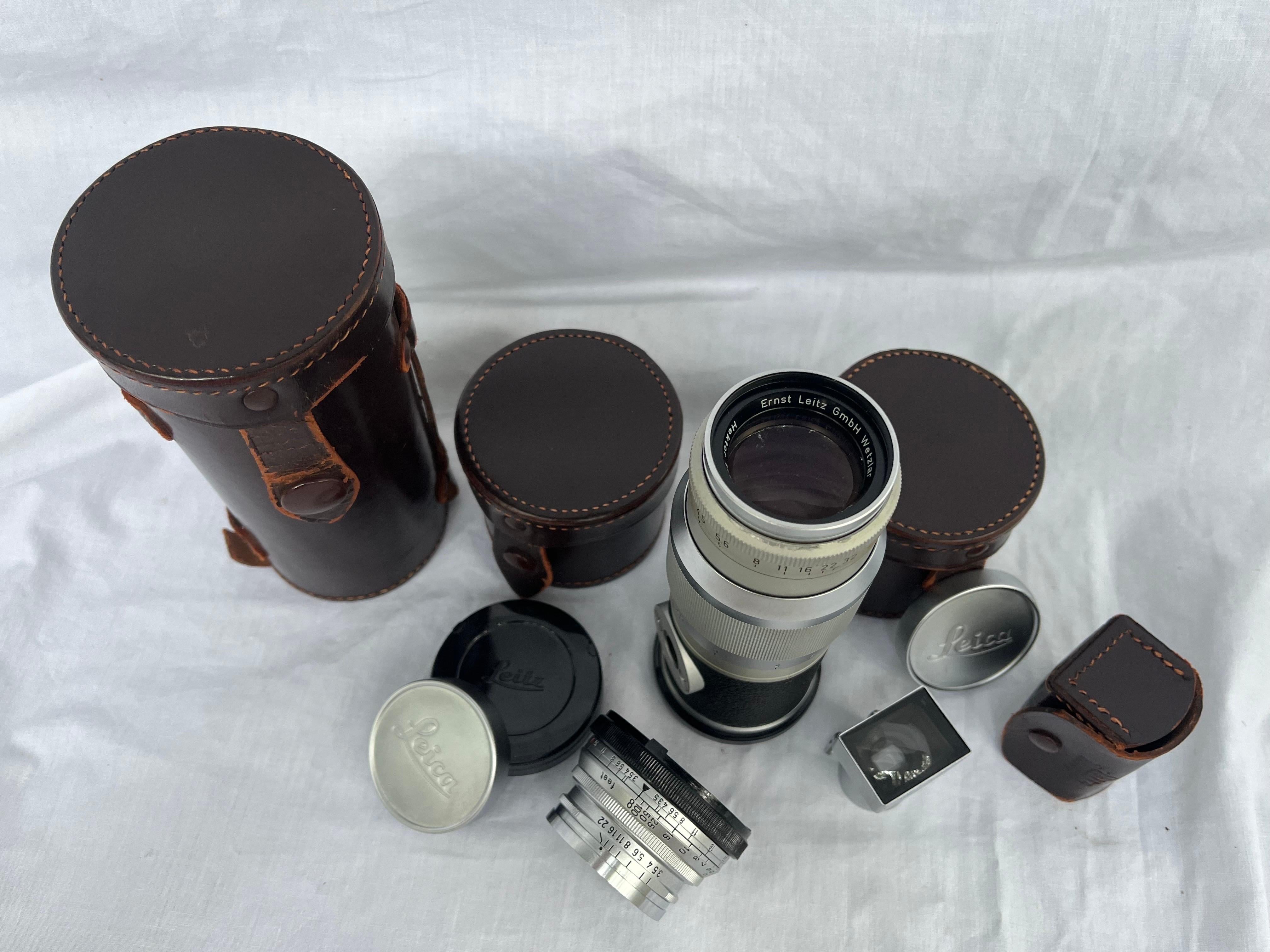 A collection of mid 20th century Leica / Ernst Leitz lenses. There is a Summaron, a Hektor and a Range Finder. Also, cases and lens caps. All of these have been previously used. What makes Leica so good you may be asking. Well here's a quote that's