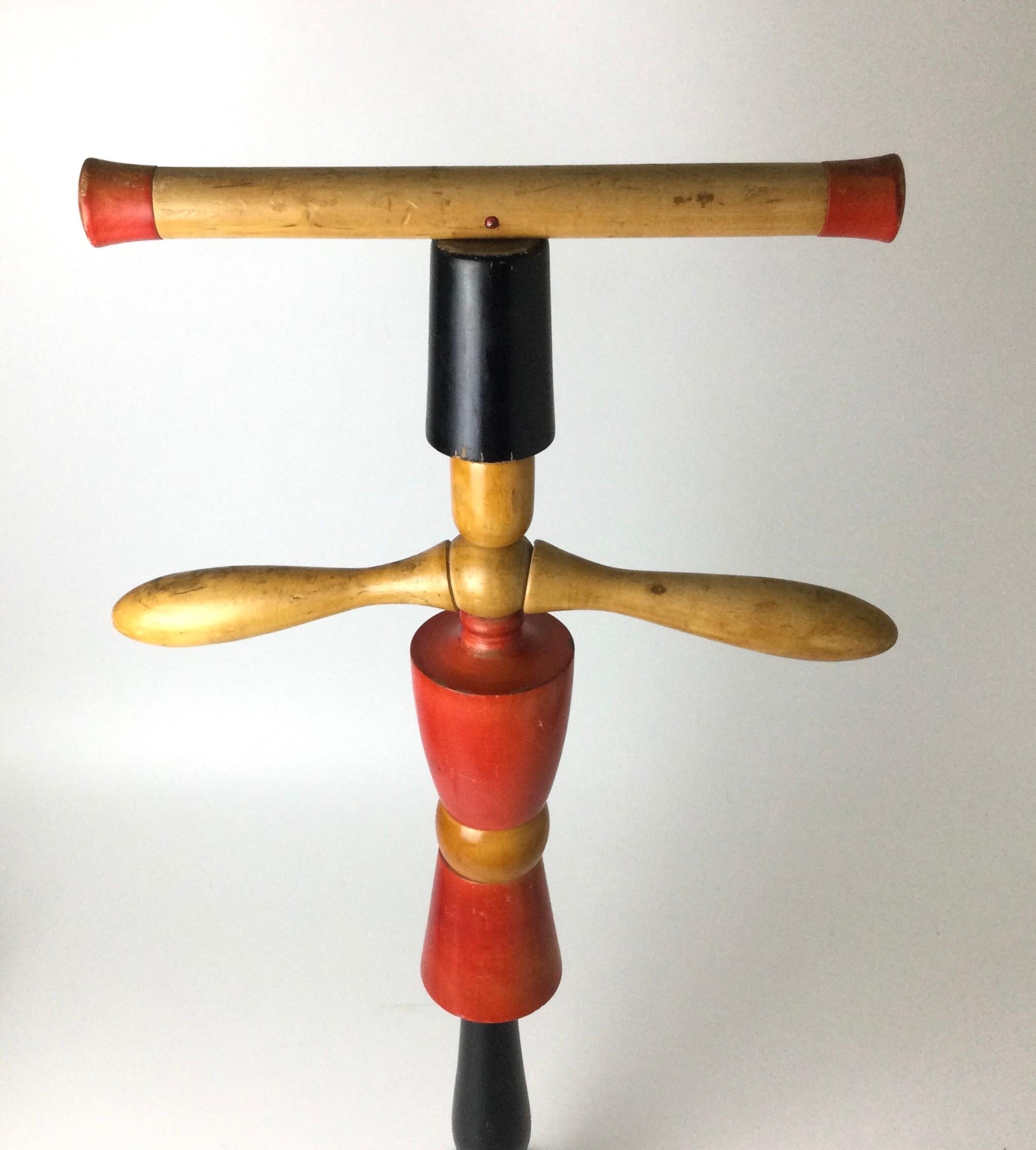 Mid-century child’s valet fashioned from turned wood and whimsically painted. Possibly made by the Italian company Ma.Gi. No markings. 32