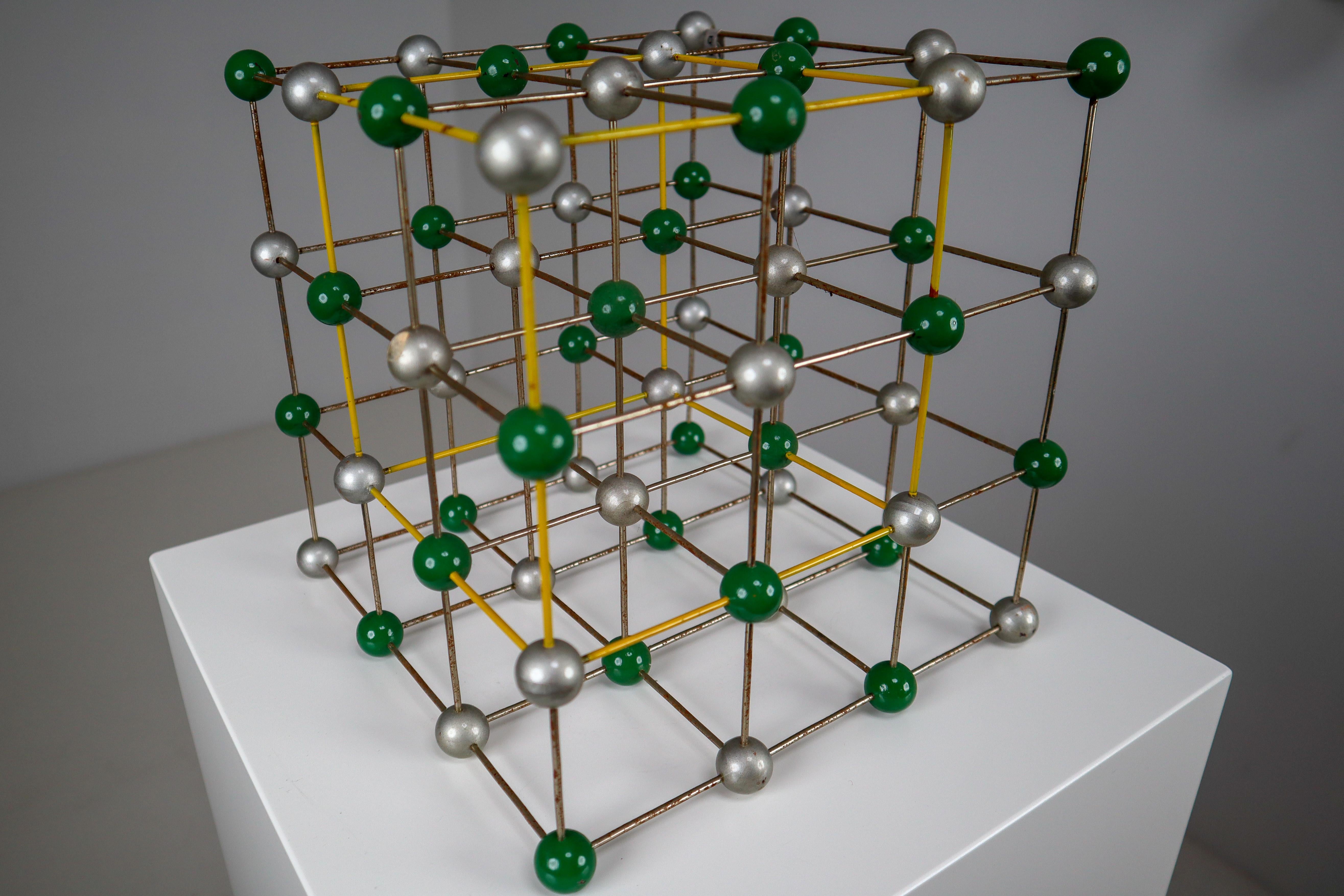 This beautiful patinated metal 1950s molecular structure will display great on any table for presentation. It measures very nicely at 9.75 x 9.75 x 9.75. The piece was used for study in a school in Prague back in the early or late 1950s. It still