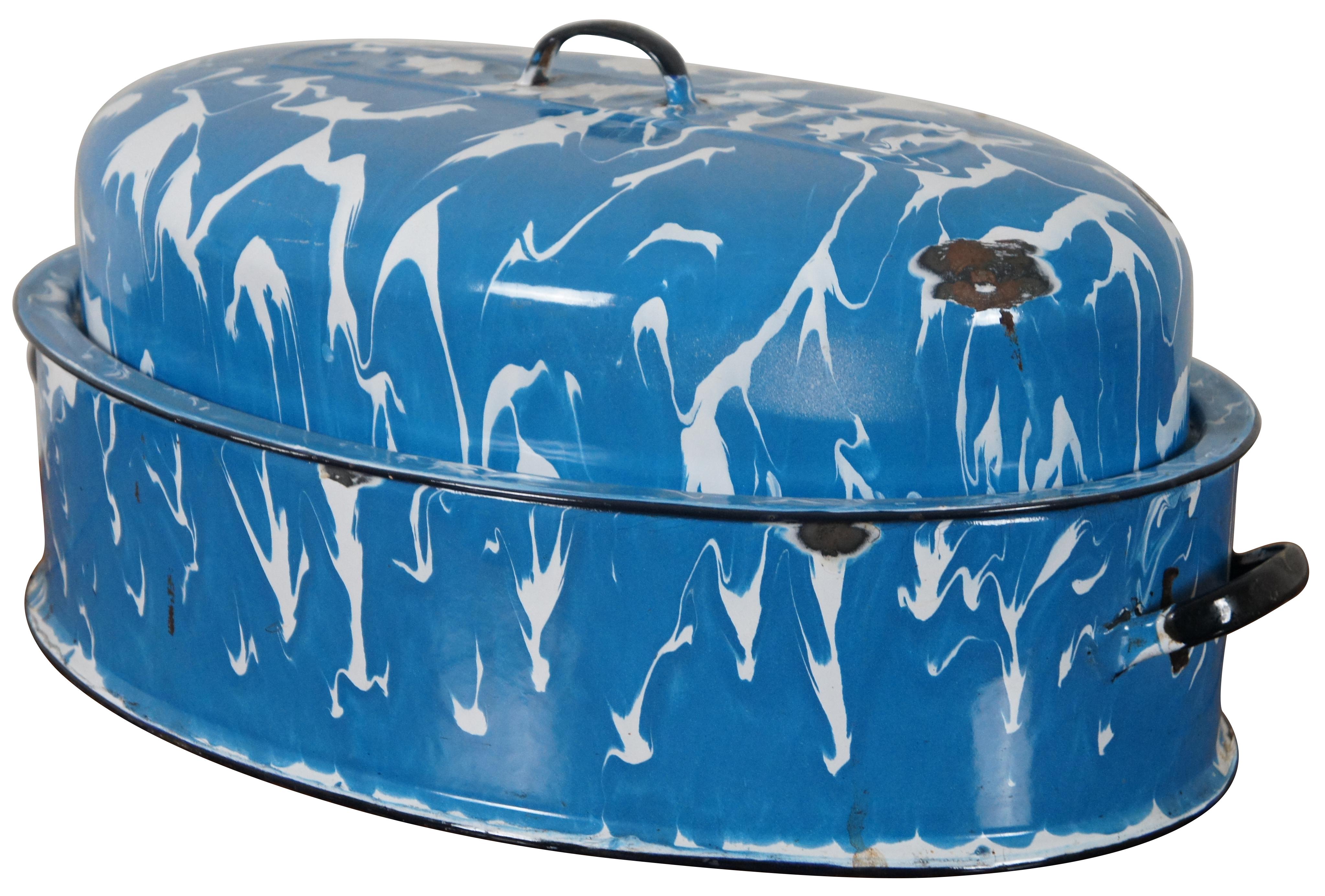 Rare mid century large oval size Columbian turkey roasting pan or pot featuring enameled blue and white marble swirl with lid and handles.

Columbian Home Products purchased the cookware division of General Houseware Corporation in 1998. GHC