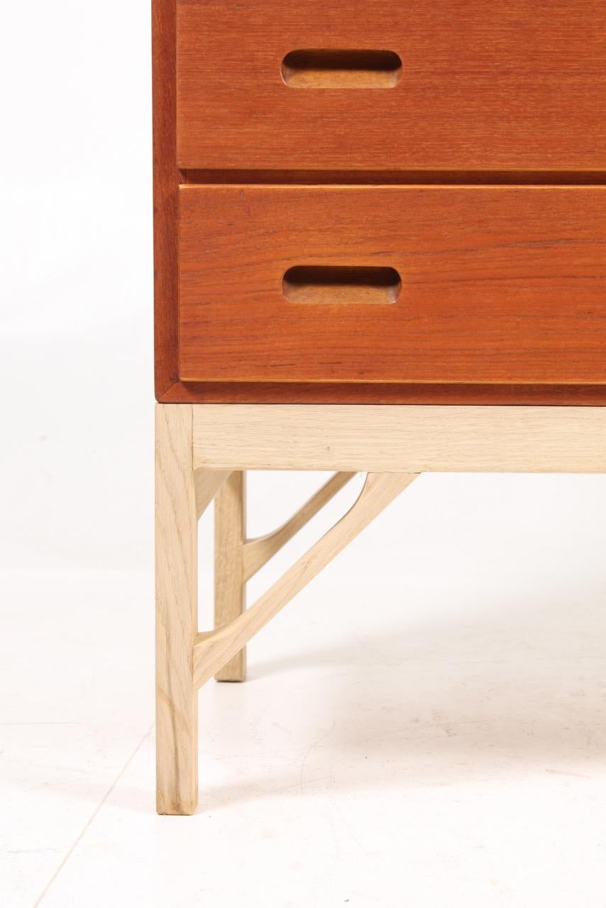 Commode in oiled teak on a base in soap finished oak. Designed by MAA. Børge Mogensen in the 1950s, this piece is made by CM Madsen cabinetmakers Denmark in the 1960s. Great restored condition.