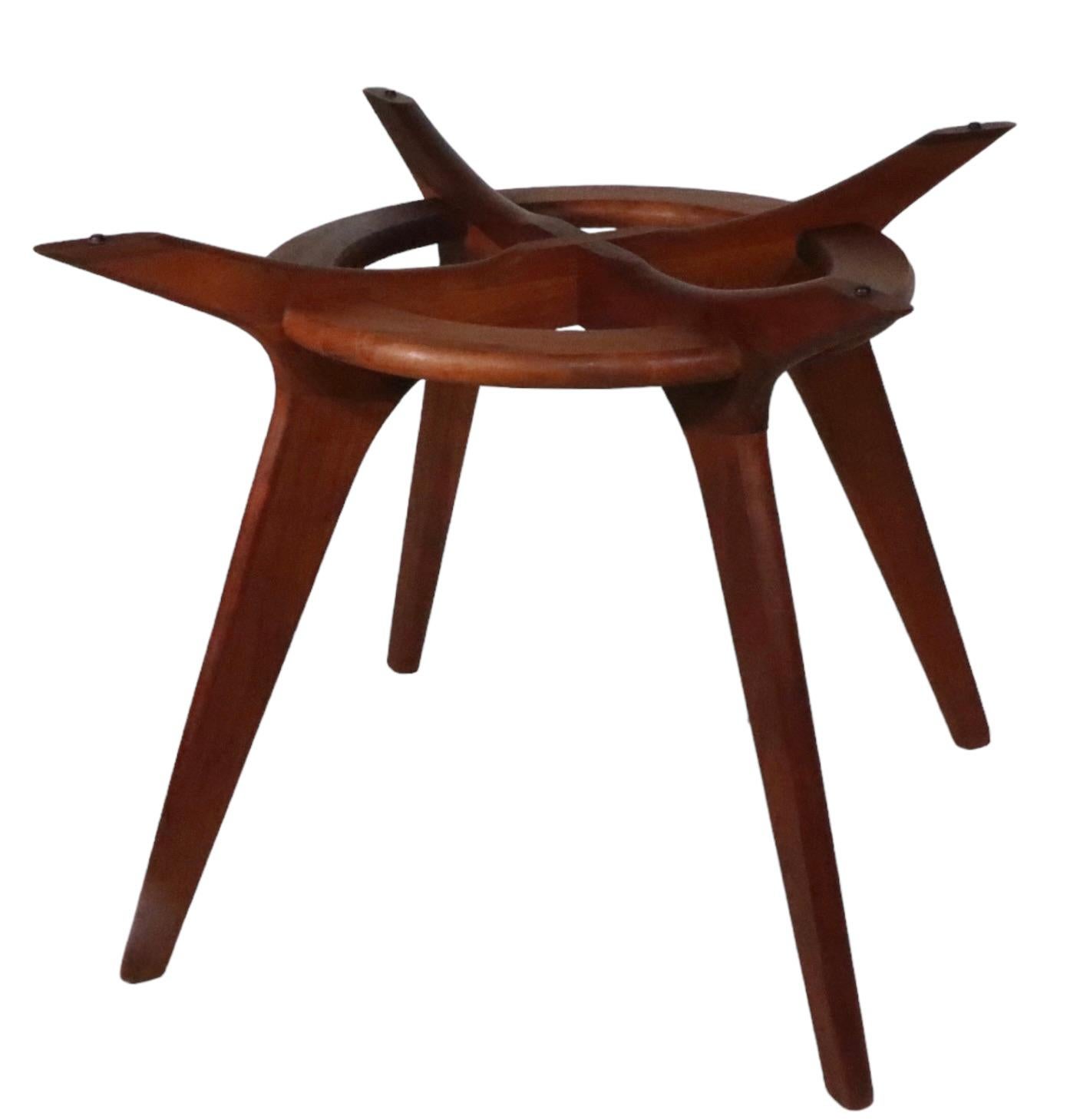 Iconic Mid Century design, compass dining table designed by Adrian Pearsall, for Craft Associates, circa 1960's. The table features an architectural and sculptural wood base, which supports the original round  thick glass top. This example is in