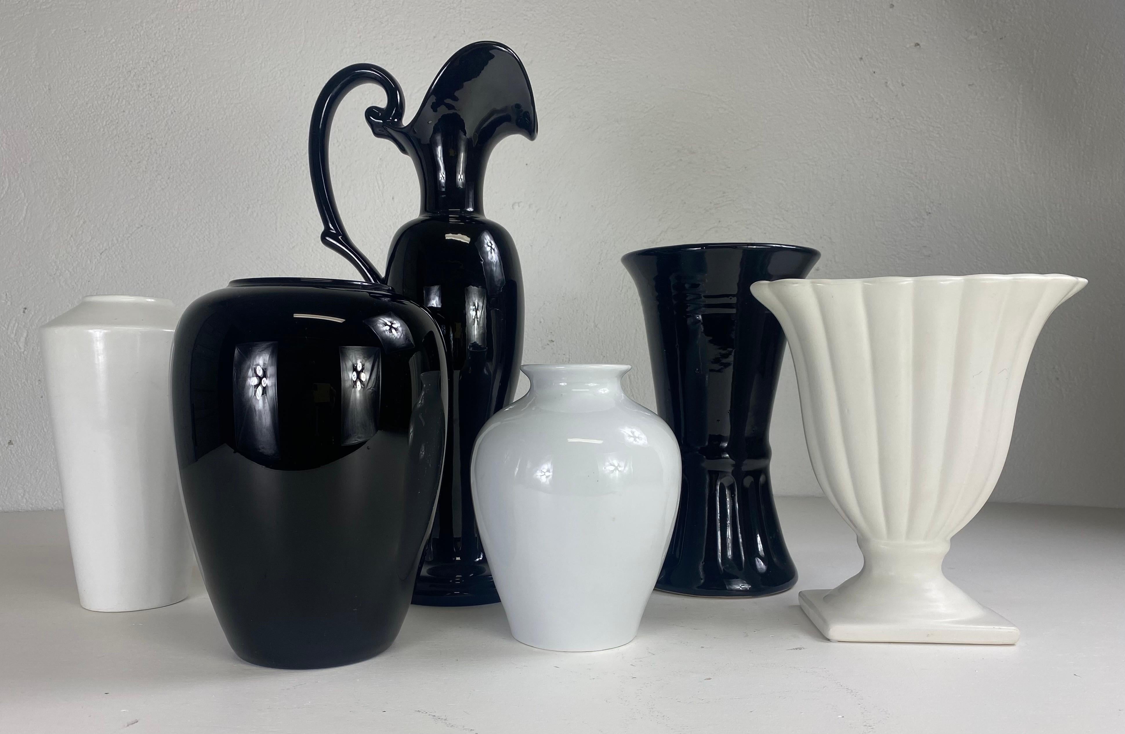 Mid century complementary grouping of black and white pottery vases. For Sale 3