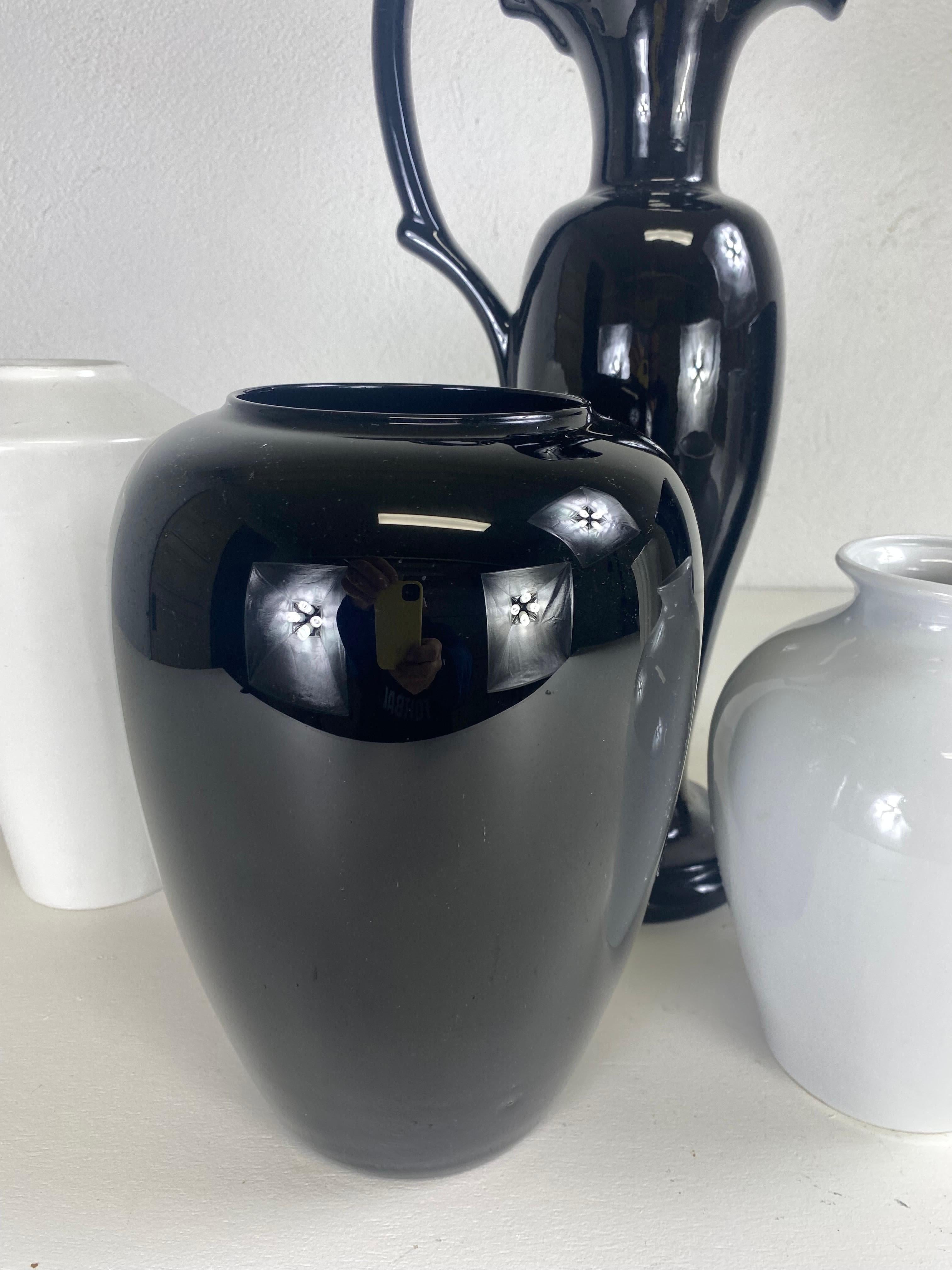 American Mid century complementary grouping of black and white pottery vases. For Sale