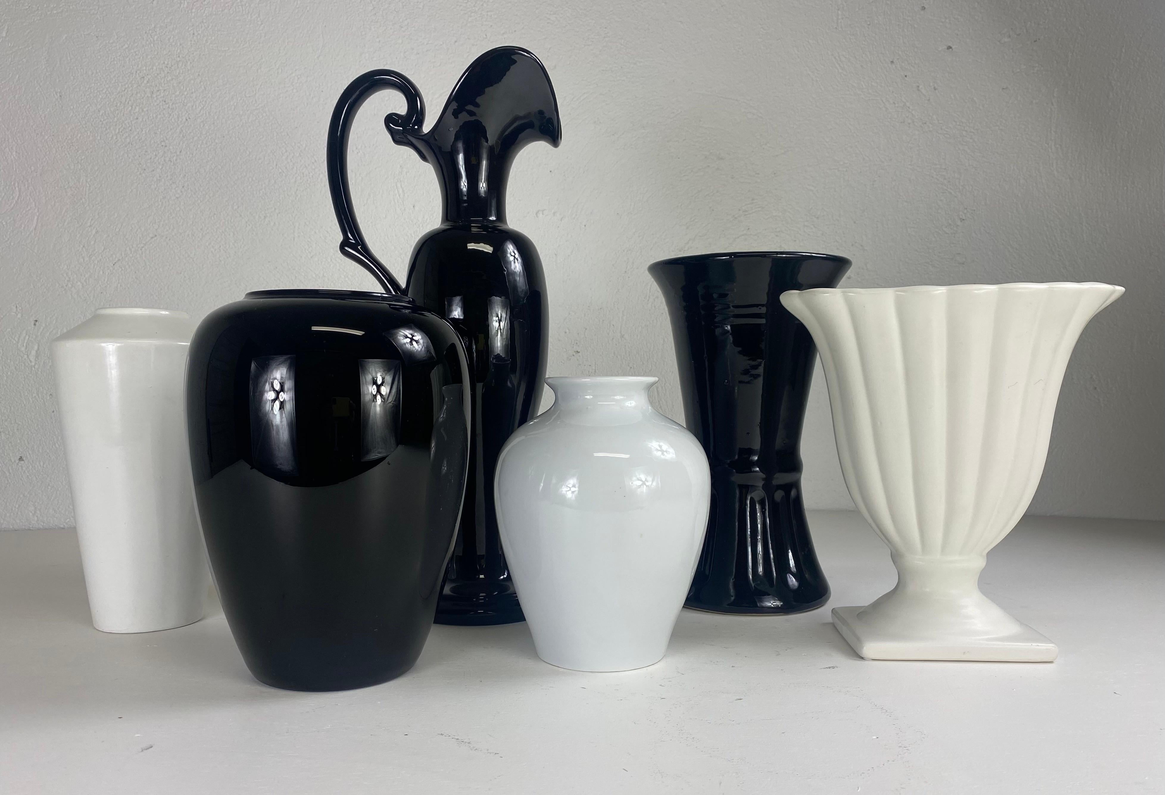 Mid century complementary grouping of black and white pottery vases. In Good Condition For Sale In Allentown, PA