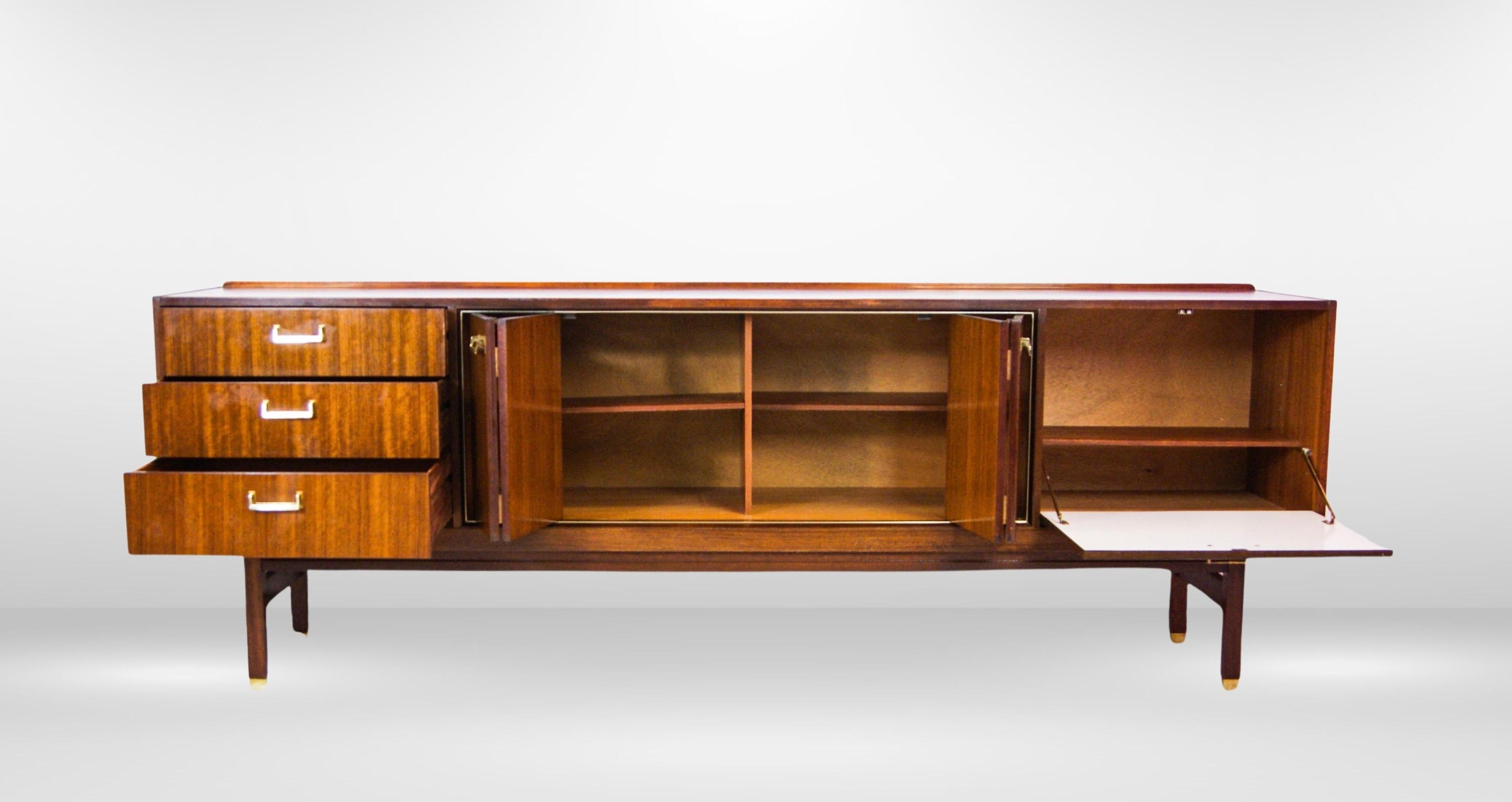 British Retro 1950s Long Teak Sideboard by E Gomme With Brass Handles & Concertina Doors For Sale