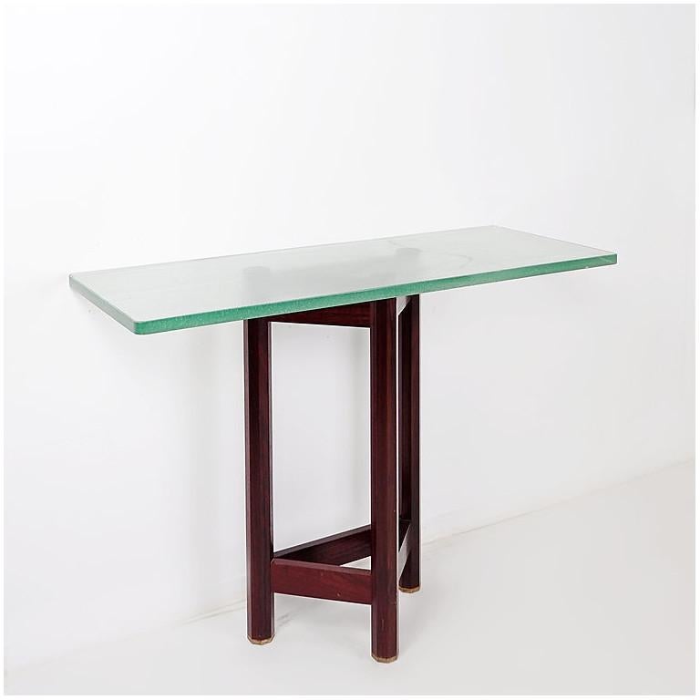 Console table with brass feet, wooden structure and glass top. Made by Jan Vlug in Belgium, mid-century. 