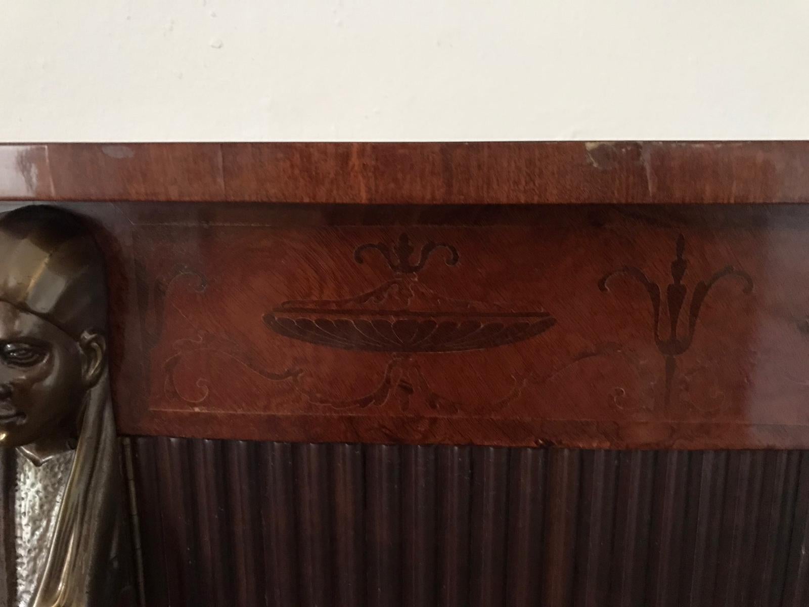 A beautiful midcentury Italian console table in return from Egypt style. Mahogany veneer and Fruitwood marquetry with exquisite bronze ornaments.