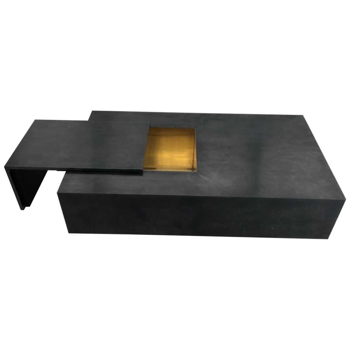 Ultra chick modern goatskin lacquered coffee table.
Brass legs.
Description
Lacquered charcoal goatskin.
Sliding top to reveal gold interior storage compartment.
Polished brass base.
Materials: Leather, brass
Dimensions:
Width 63