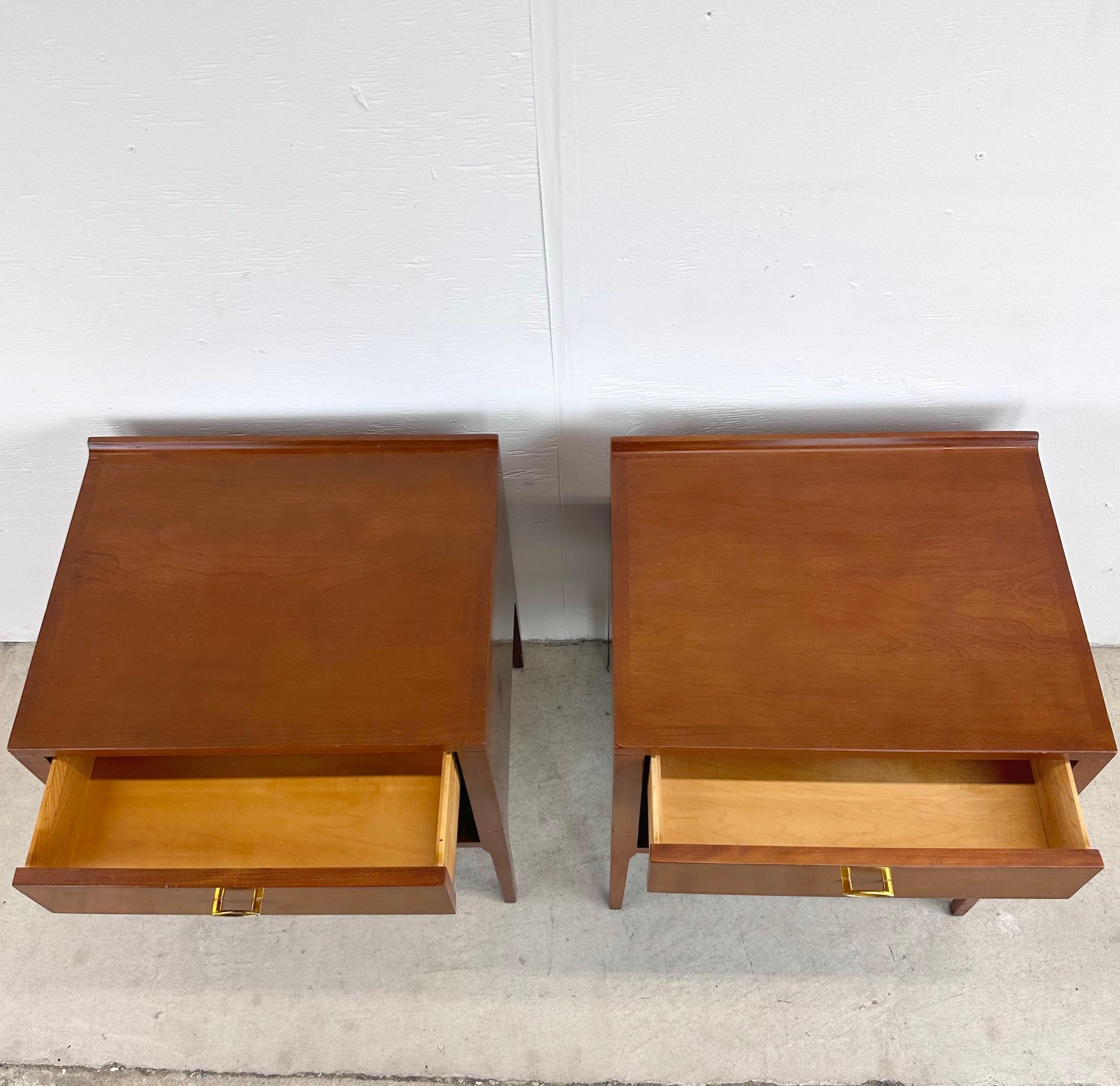 Experience the perfect blend of form and function with this matching mid-century pair of Heywood-Wakefield Contessa Nightstands by Carl Otto. These iconic pieces of mid-century design bring a touch of timeless elegance to your bedside, transforming