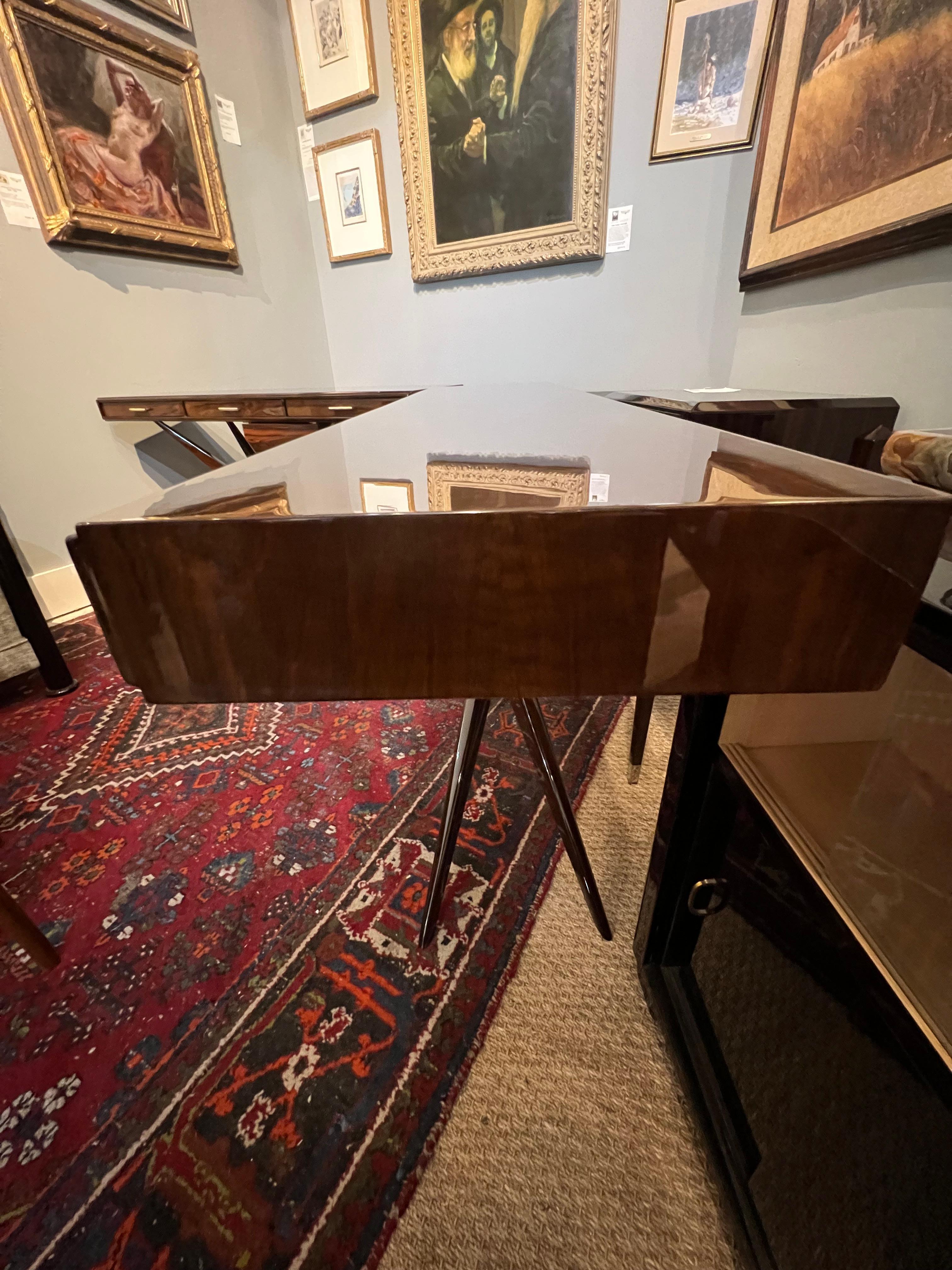 Console is made out of high quality walnut wood. Has 3 slim drawers with chrome handles. Four elongated legs are connected in the middle with decorative metal element, creating X shape.

Condition is perfect, restored
Continental, c. 1960s
Measures: