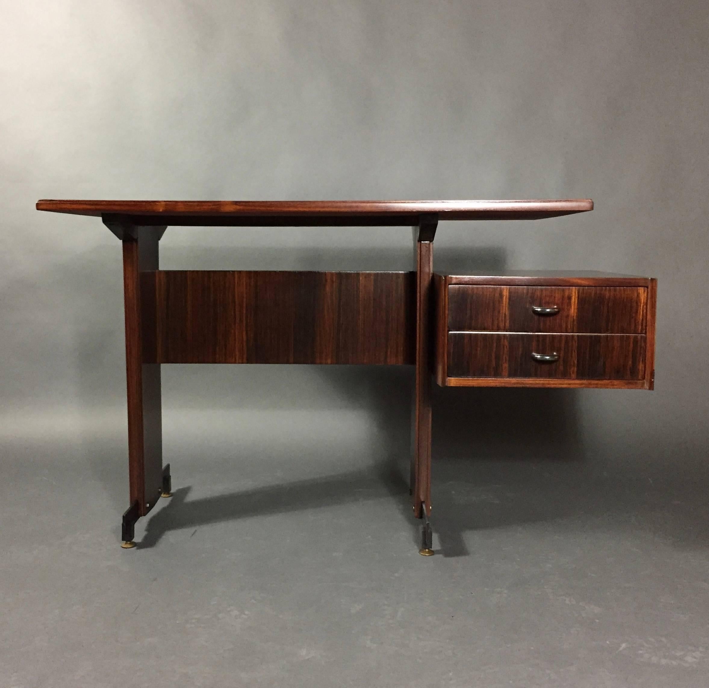 Traditionally made as a dressing table, this nicely proportioned piece can be perfect as a small hall table or desk. Recently refinished dark-stained mahogany with black powder-coated metal supports and brass feet. Possibly Scandinavian, though more