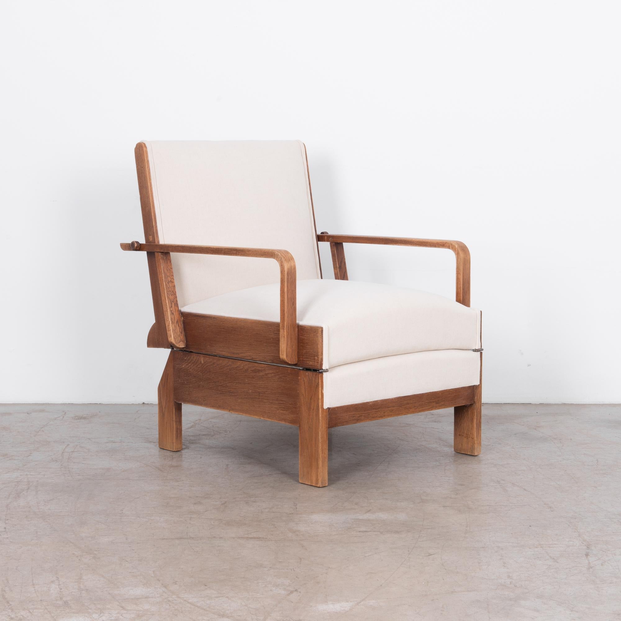 This unique piece, is a circa 1950, un-foldable chaise lounge. From the golden age of midcentury Czech design, this piece looks great as a low chaise lounge, or folded up as an armchair. Practical and stylish, this chair is realised in oak veneer,