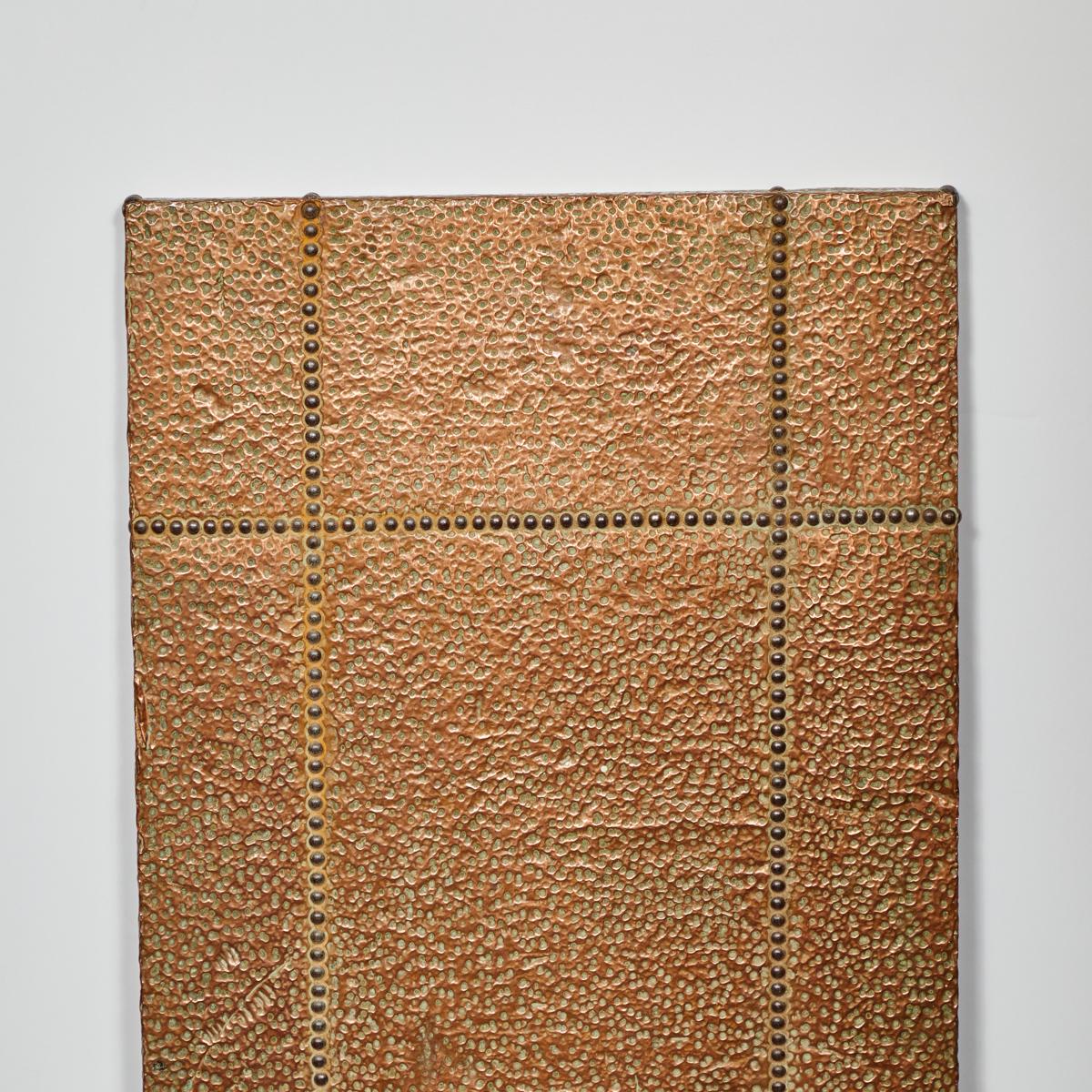 French mid-century highly textured copper and brass riveted panel. A piece of art in its own right, the panel is riddled with a unique copper texture reminiscent of webbing. Stylistically it has shades of art deco and the modernist decorative arts