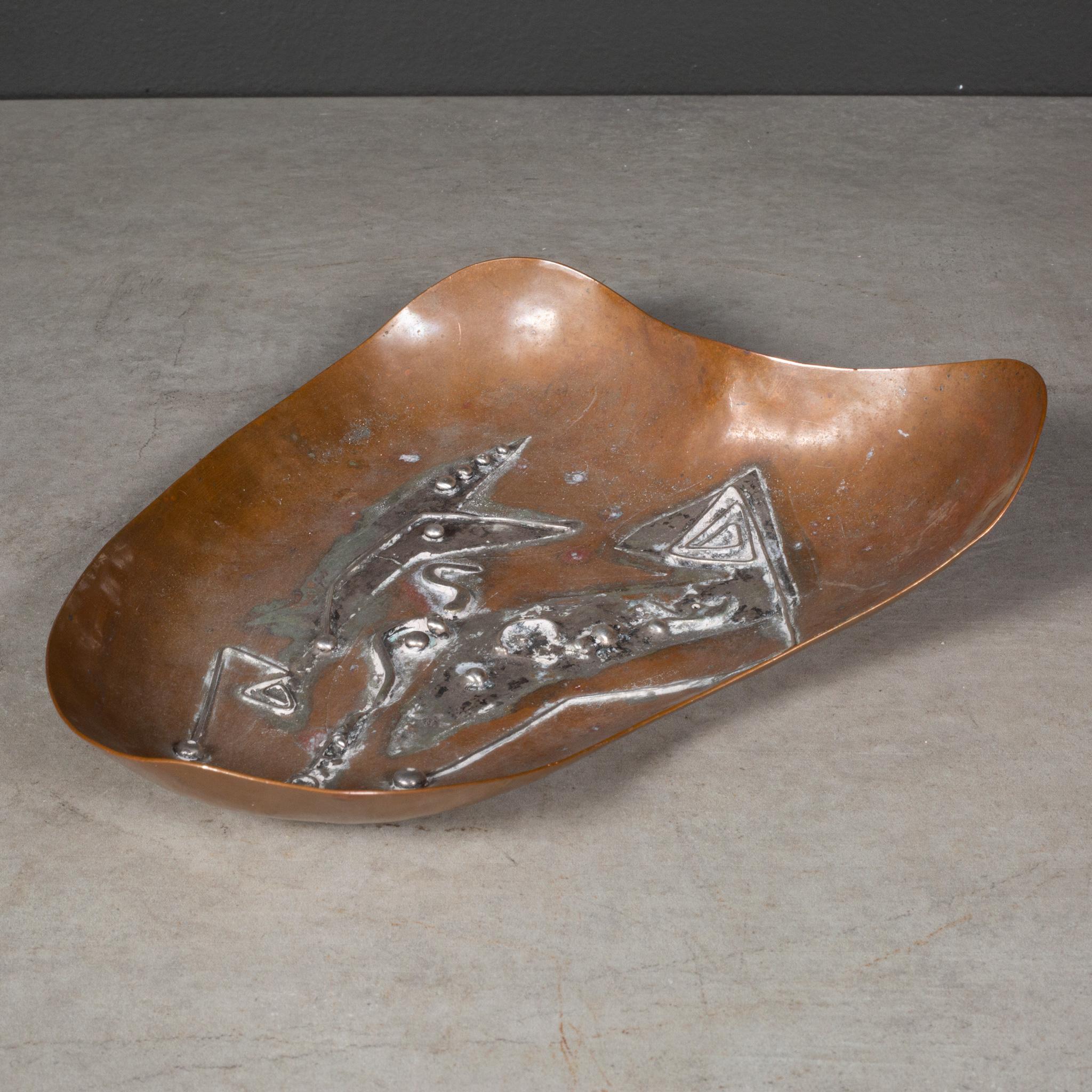 ABOUT

A mid-century kidney shaped copper trinket dish with silver applique. Stamped 