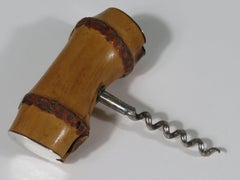 Mid century corkscrew in bamboo finished with silver.