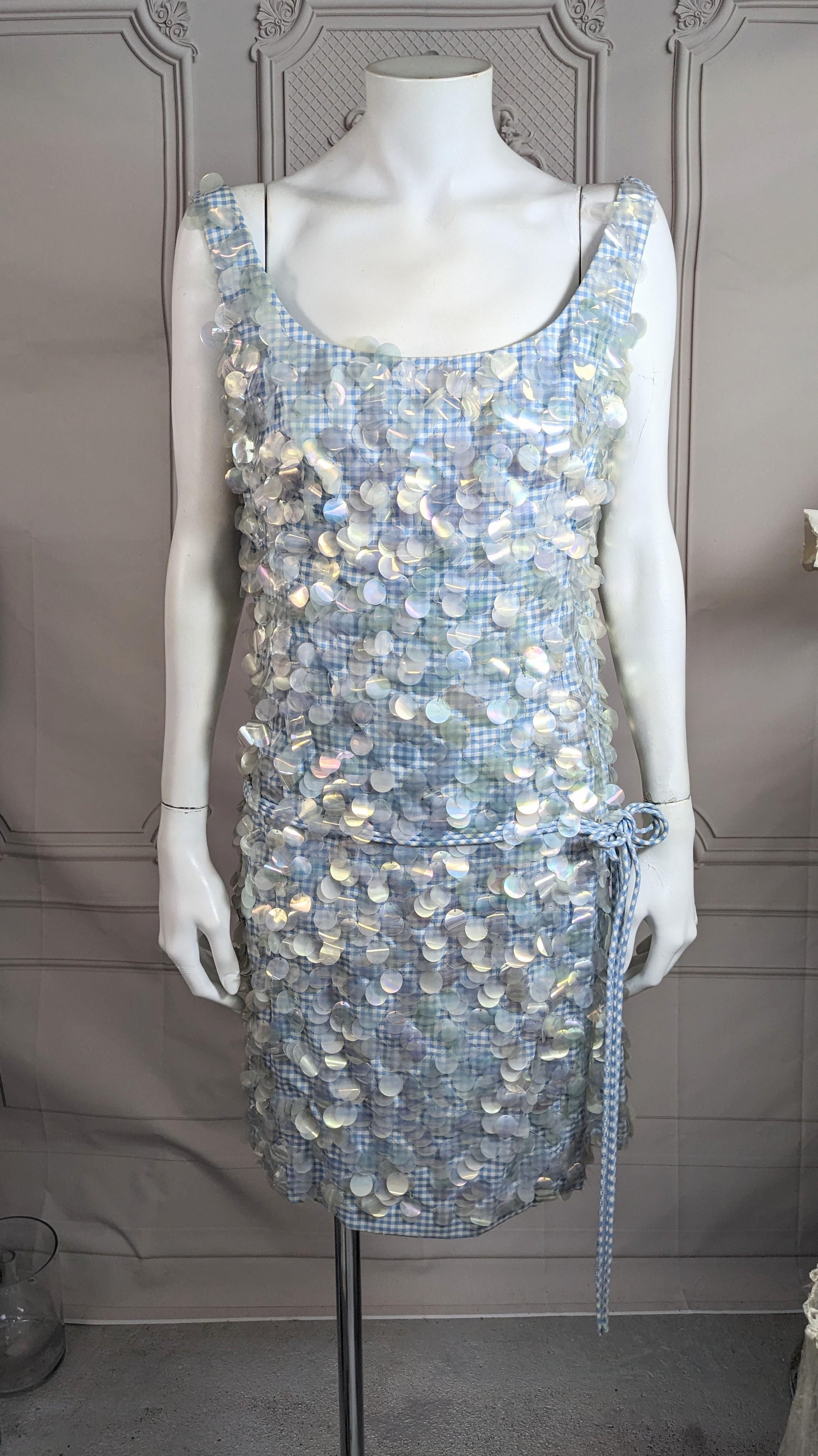 Charming Cotton Gingham Paillette Encrusted Dress from the 1960's. Classic American textile with the extravagance of iridescent paillettes. Simple sheath shape with wide scoop neckline and bias cord attached belt. Back zip entry, perfect summer