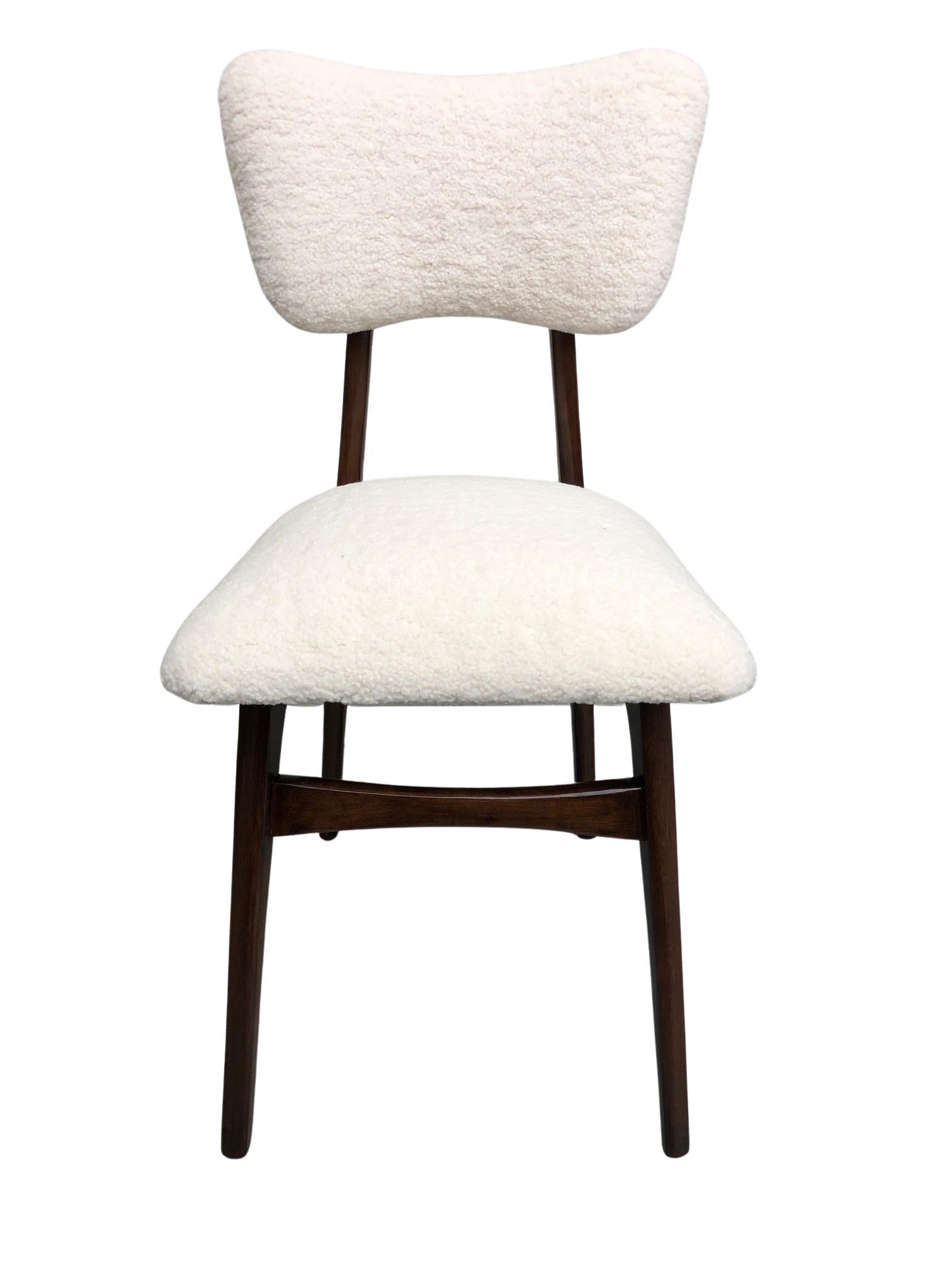 Unique set of four chairs manufactured in Poland in the 1960s, designed by Rajmund Halas. The upholstery is made of pleasant to touch boucle textile. It is high quality and durable italian fabric in a warm cream color. The chair structure is made of
