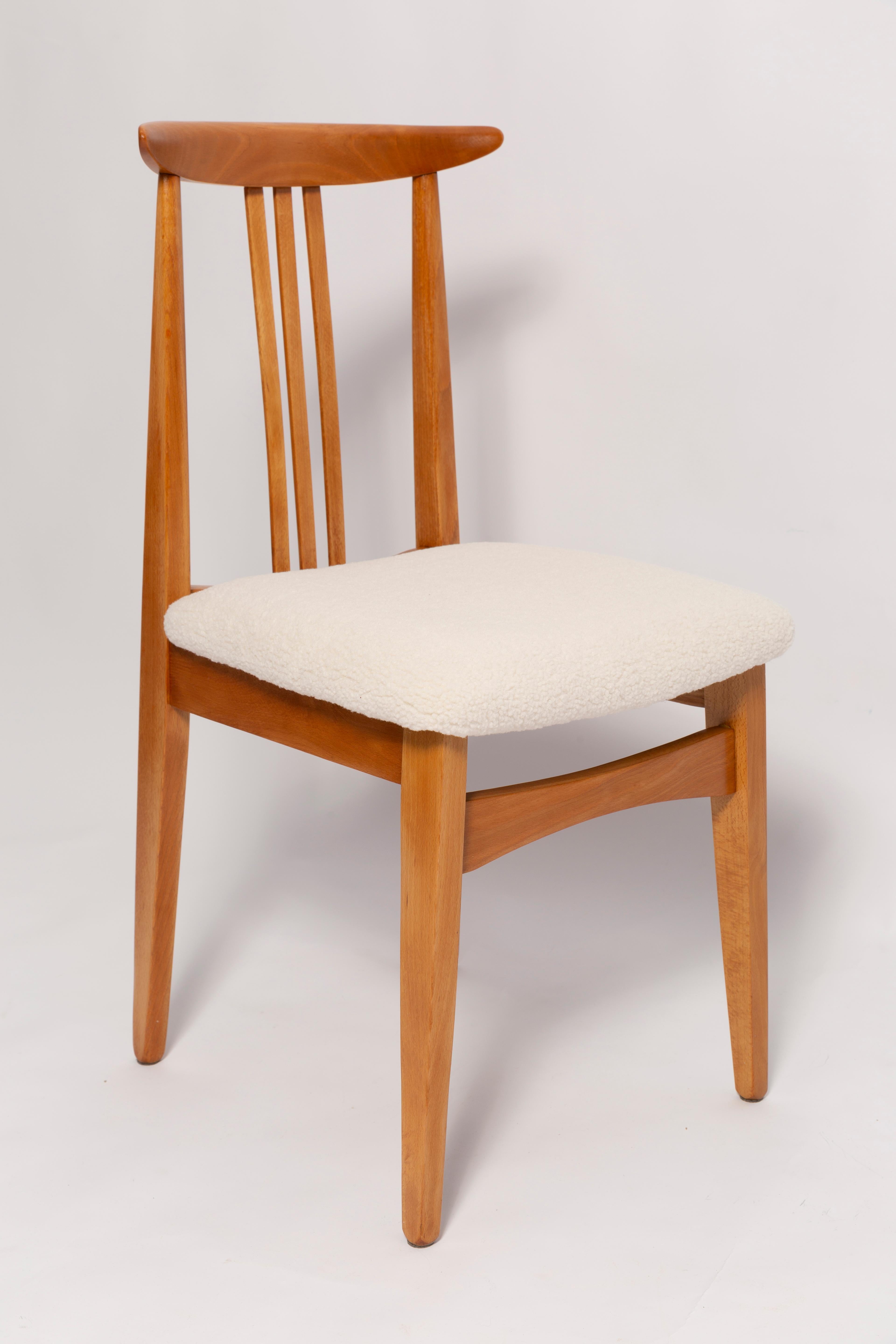 A beautiful beech chair designed by M. Zielinski, type 200 / 100B. Manufactured by the Opole Furniture Industry Center at the end of the 1960s in Poland. The chair is after undergone a complete carpentry and upholstery renovation. Seats covered with