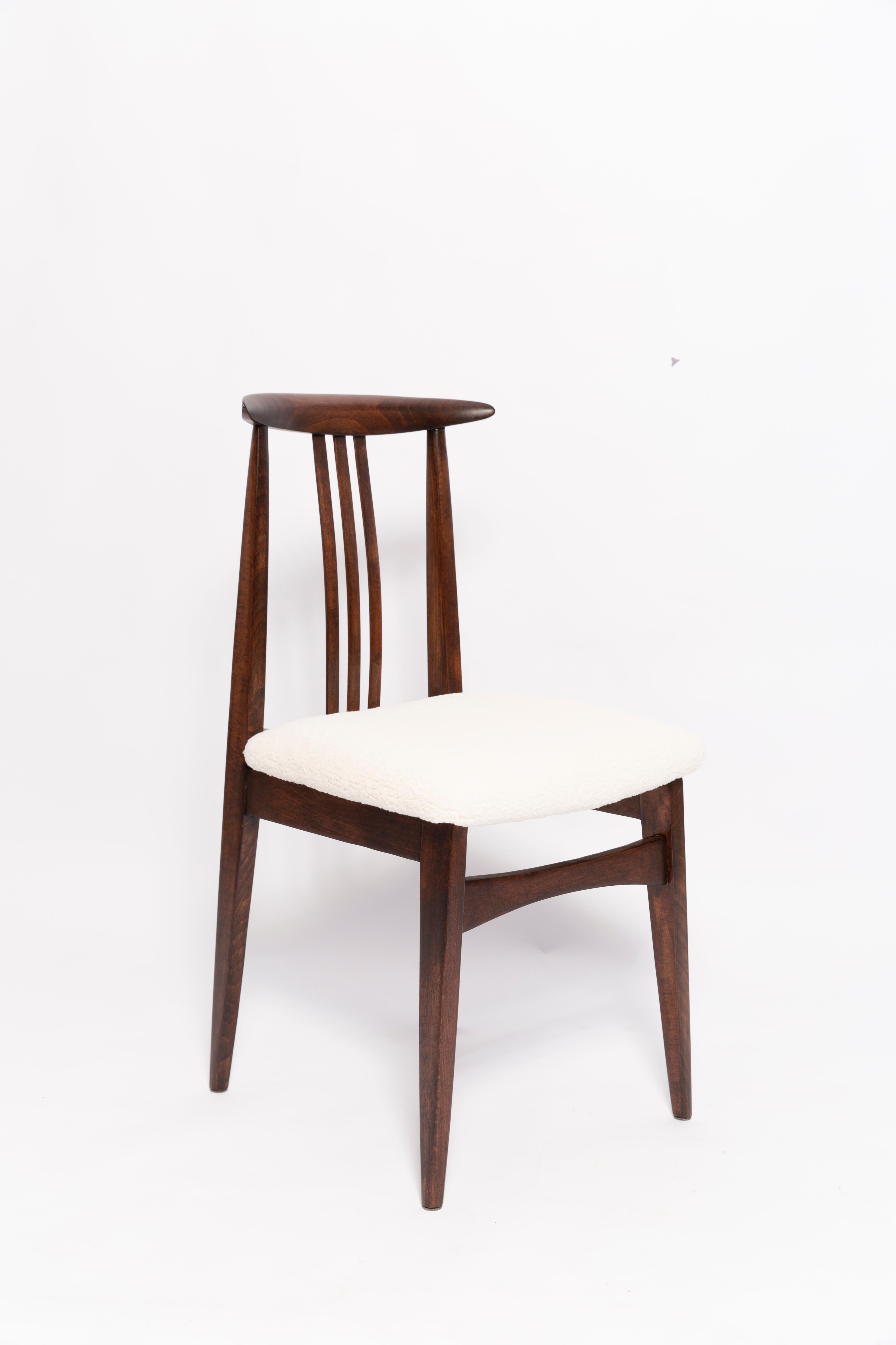 A beautiful beech chair designed by M. Zielinski, type 200 / 100B. Manufactured by the Opole Furniture Industry Center at the end of the 1960s in Poland. The chair is after undergone a complete carpentry and upholstery renovation. Seats covered with