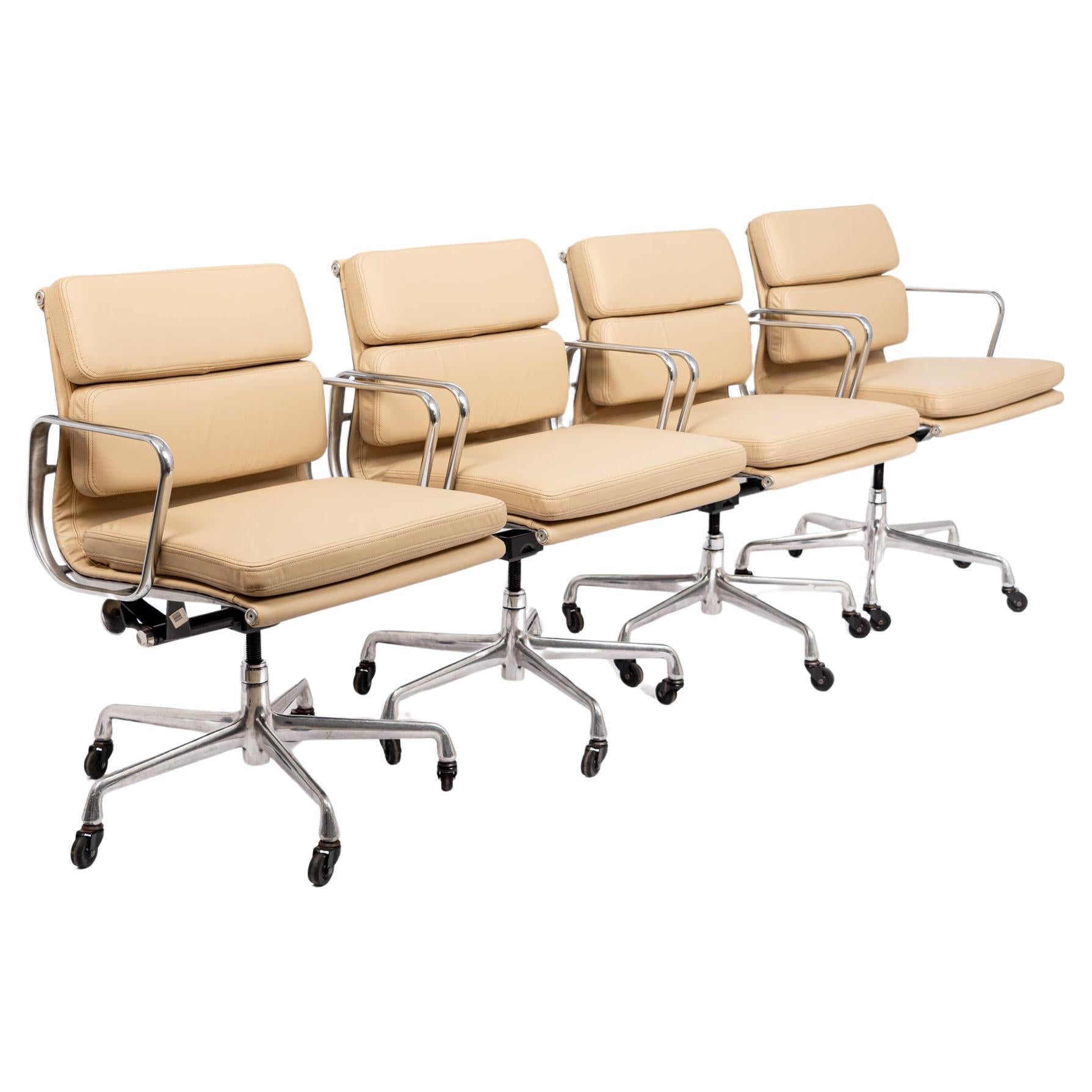Listing is for 6 chairs.

These authentic Eames for Herman Miller Soft Pad Management Height cream leather office chairs from the Aluminum Group Collection were manufactured in the 2000s. This classic mid century modern office chair was first