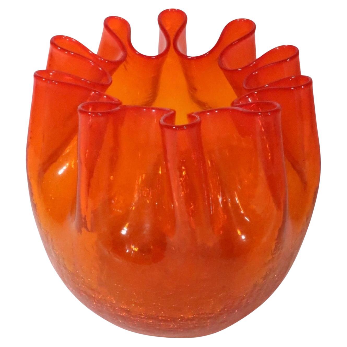 Hard to find crimped edge crackle glass vase, in orange/red glass. Attributed to Andersen Winslow for Blenko, unsigned. This example is in excellent, original condition, free of damage or repairs. 
