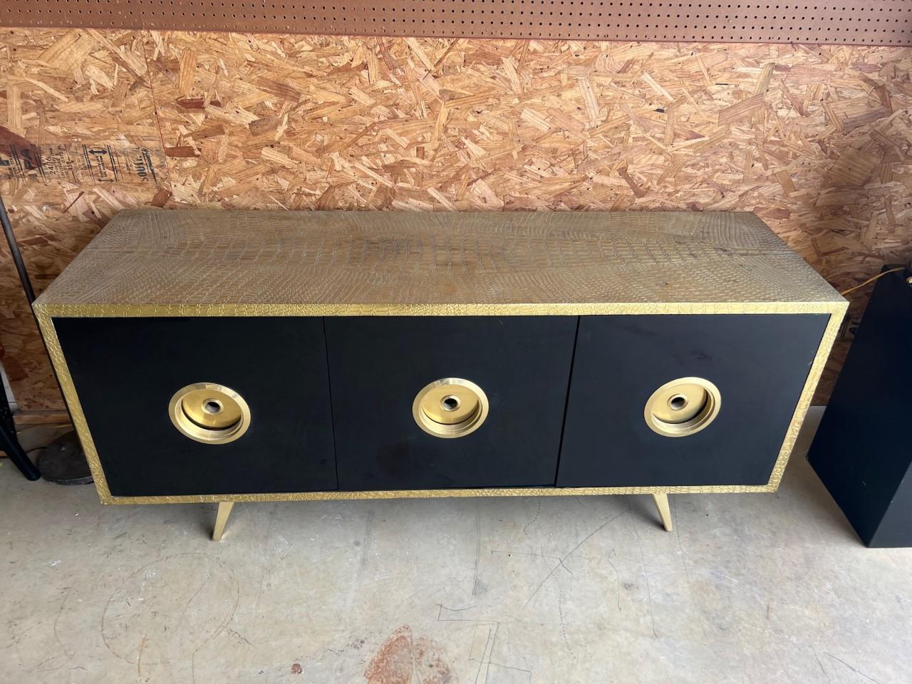 Modern crocodile design embossed brass sideboard with three drawers and three doors cover with black resin finish.

No Shelves

Condition:
Some light imperfection de-lamination
Brass finish 
Crystal coated on resin.