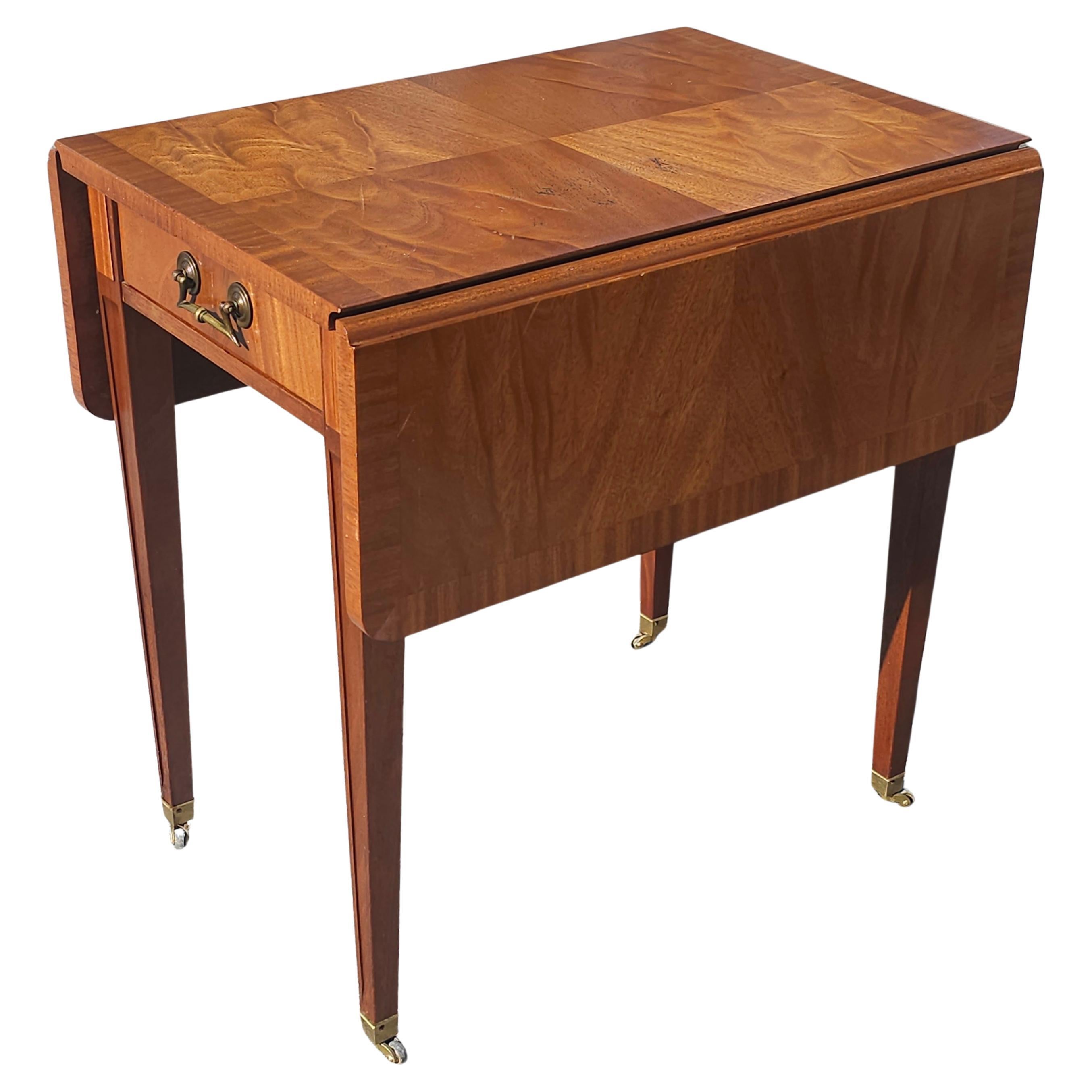 Mid Century Cross-Banded Crotched Mahogany Pembroke  Rolling Side Table For Sale