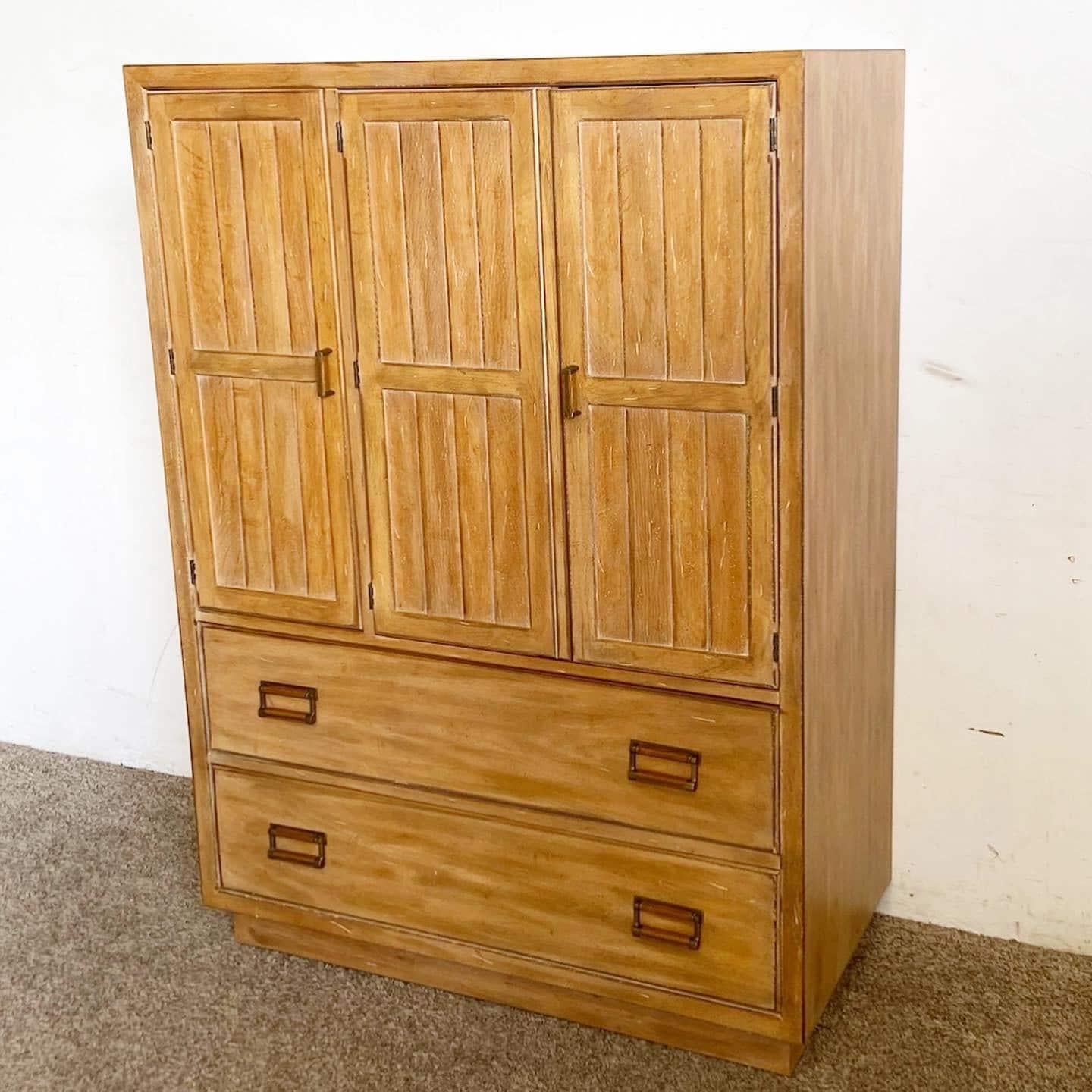 Elevate your space with the Mid-Century Drexel Highboy Armoire. Crafted by Drexel, this timeless piece offers ample storage with a blend of drawers and shelving, embodying both elegance and functionality.

Mid-Century Drexel Highboy Armoire for