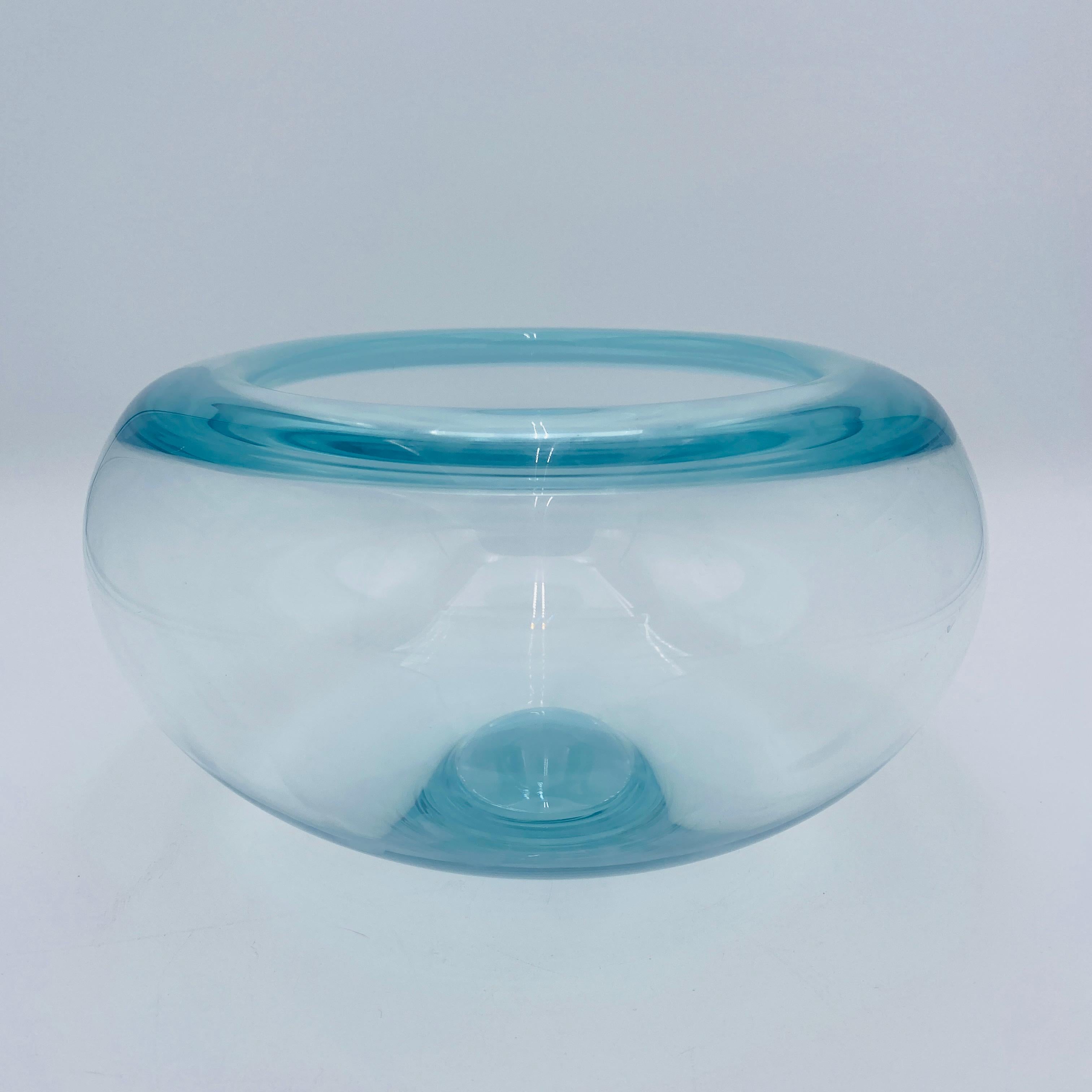 A modernist design of a bowl by Per Lutken for Royal Copenhagen. It was designed in 1955. The crystal has a bluish tone. 