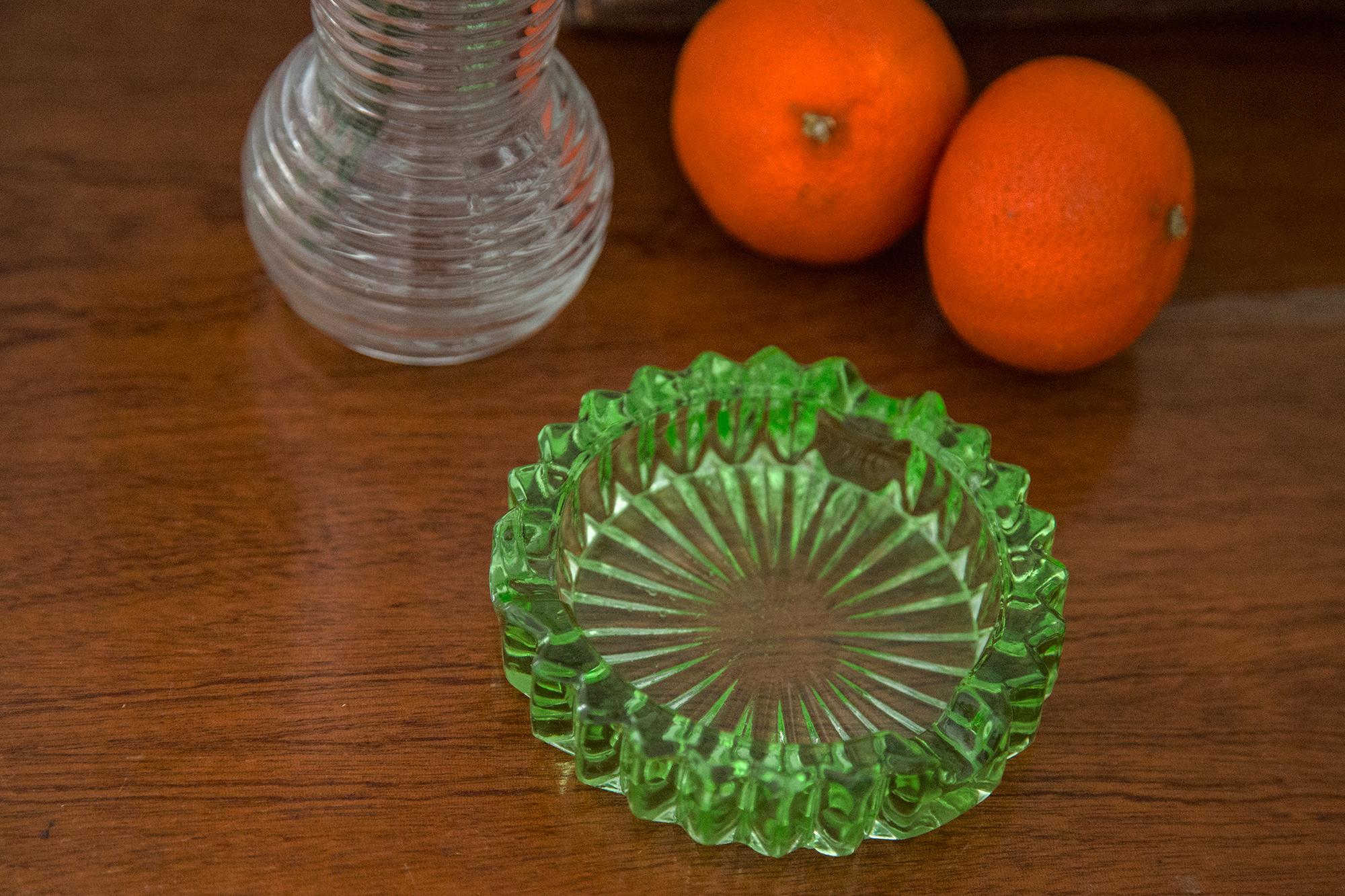 This original vintage glass ash tray bowl element was designed and produced in the 1970s in Lombardia, Italy. It is made in Sommerso Technique and has a fantastic faceted form. The vibrant color makes this items highly decorative. This item is a