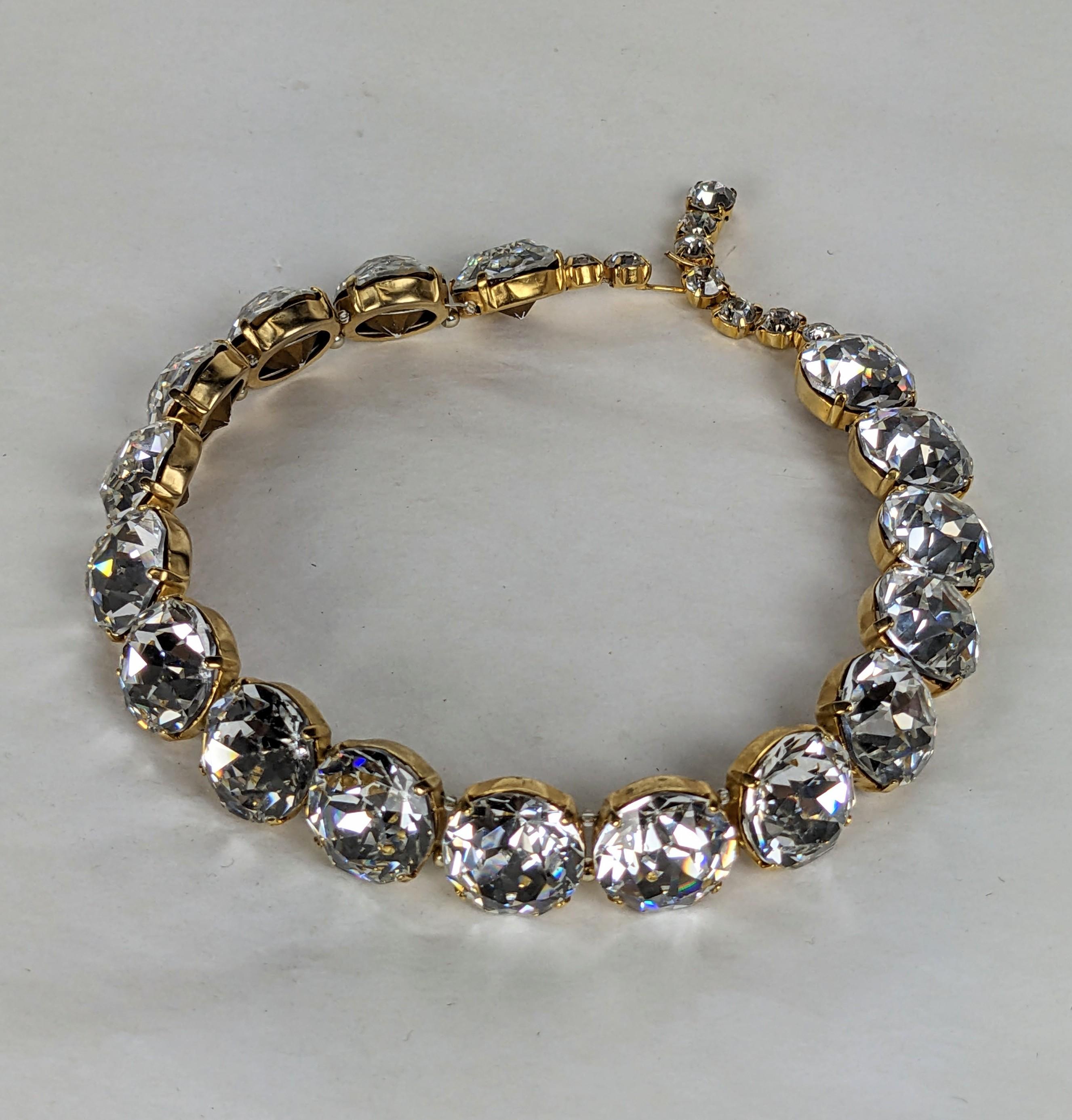 Mid Century Crystal Headlight Choker Necklace from the 1950's. Huge crystals are wired with bead spacers and set in gold toned metal. Adjustable but sits tight on the neck. Max 14.5