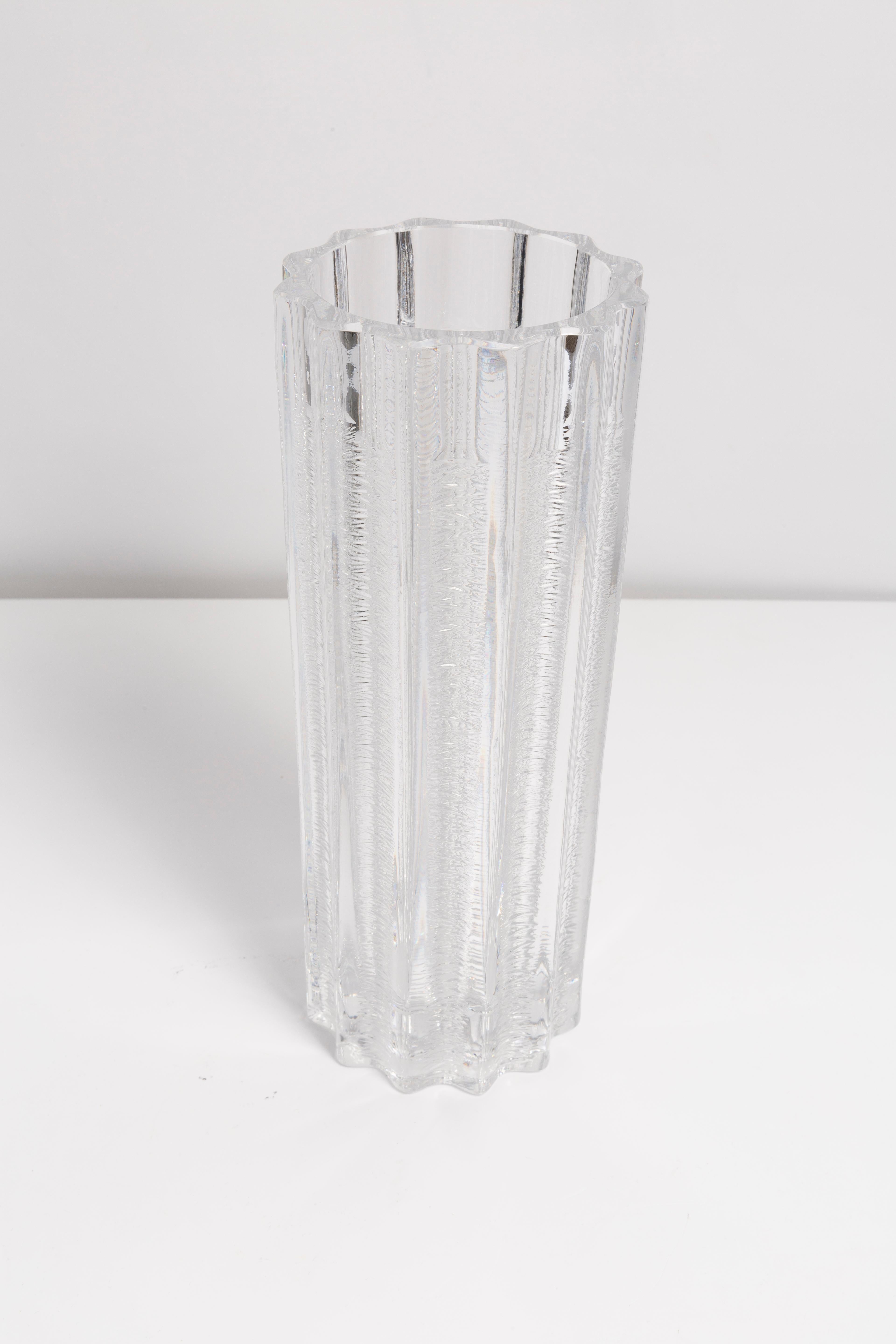 Transparent vase in amazing shape. Produced in 1960s.
Glass in perfect condition. The vase looks like it has just been taken out of the box.

No jags, defects etc. The outer relief surface, the inner smooth. 
Thick glass vase, massive.

The
