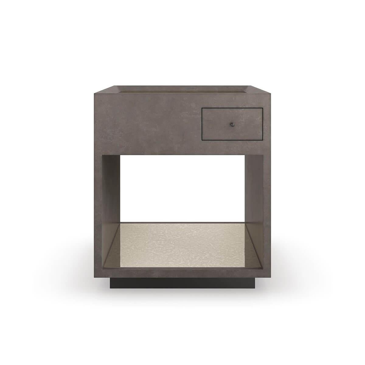 An alluring mix of materials and finishes elevates this end table, featuring a simple square shape and open space for storage and display. An antique mirrored top and shelf creates a sense of depth and warm reflection, complemented by an overall