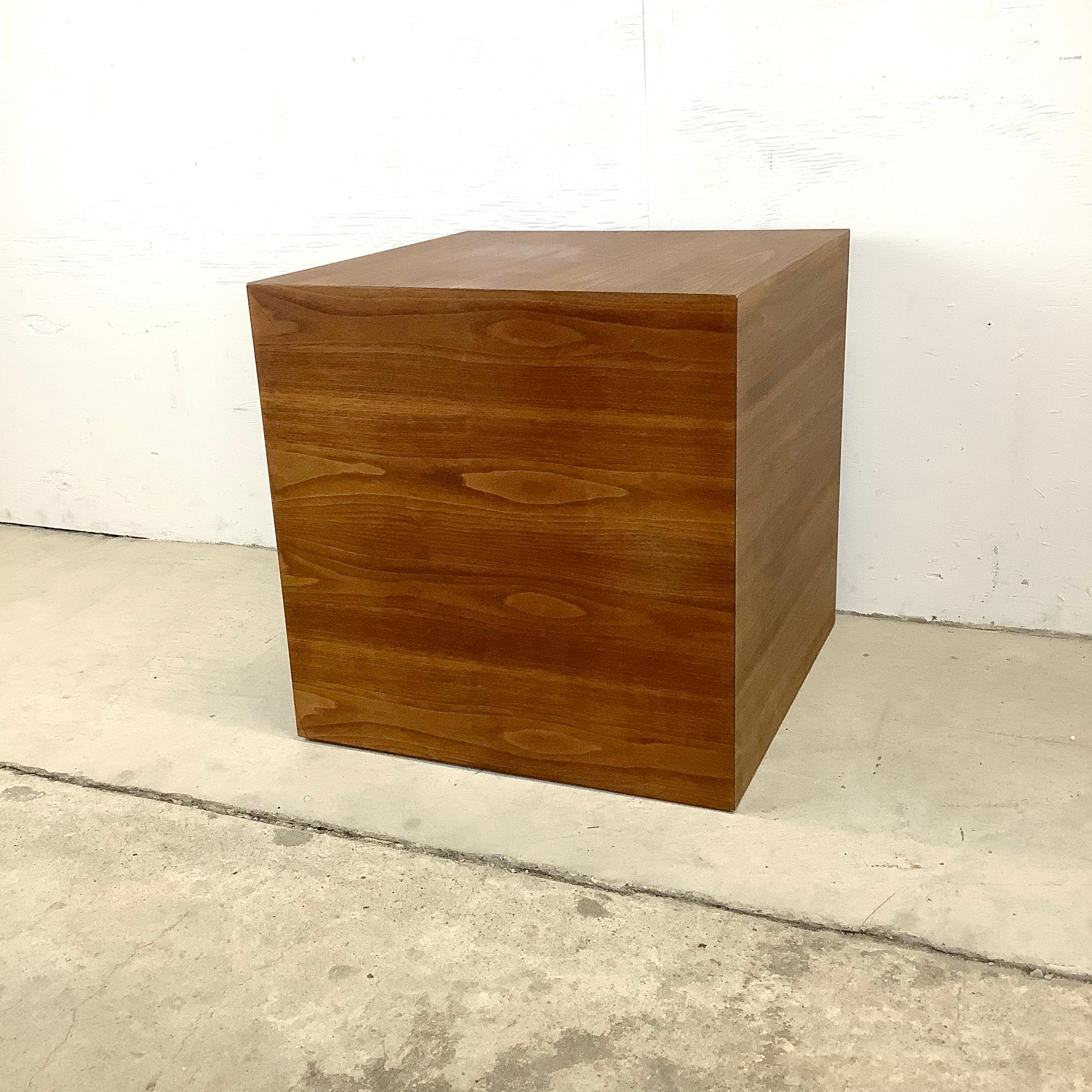 This mid-century walnut cube table makes the perfect sofa side table, lamp table, or end table for any setting. The clean modern lines and rich vintage walnut finish add warm mid-century style to any setting.

Dimensions: 20w 20d 20h

Condition: