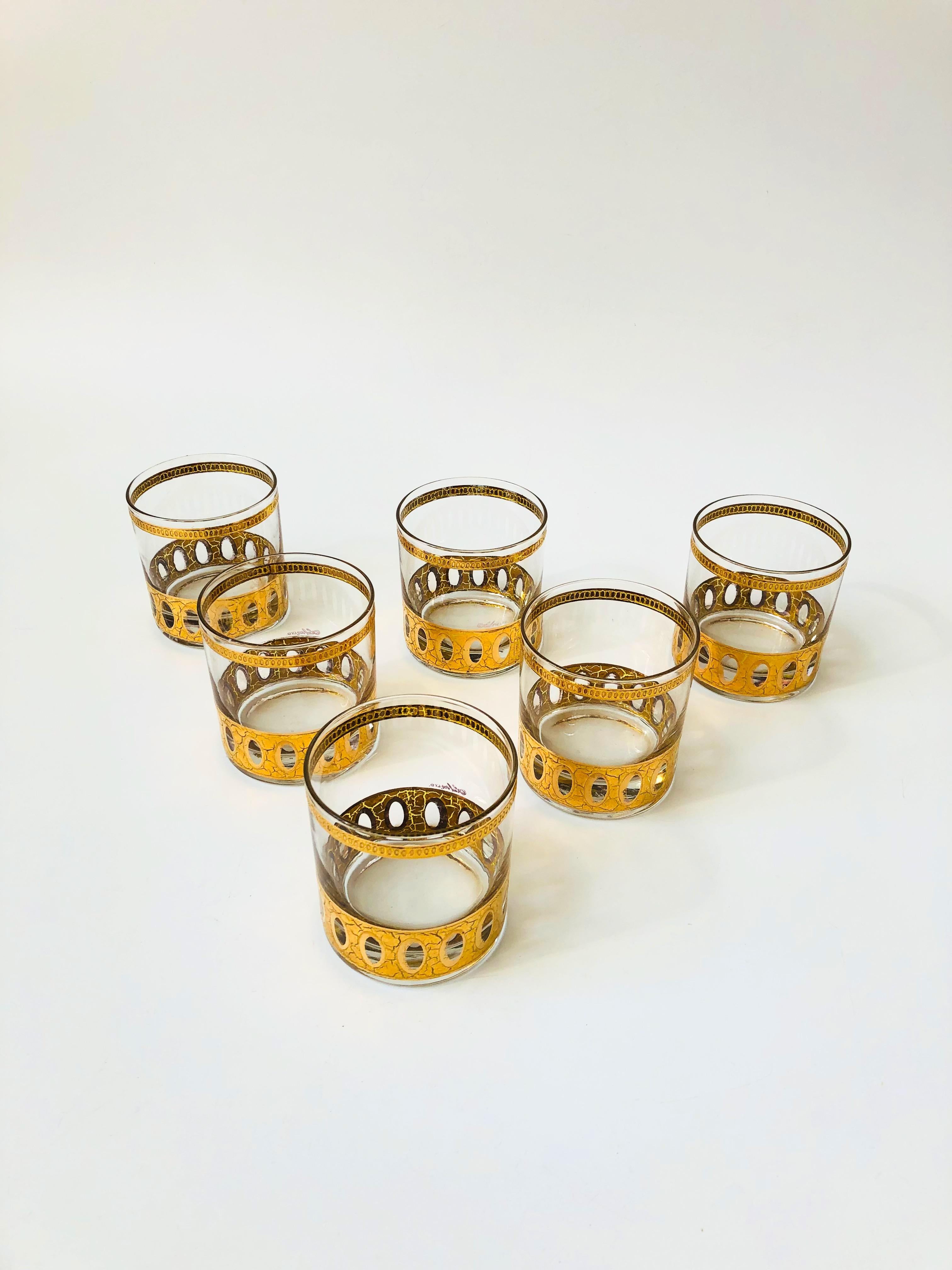 A set of 6 vintage lowball cocktail glasses by Culver. Each piece is wrapped in a beautiful 22 kt gold in the 
