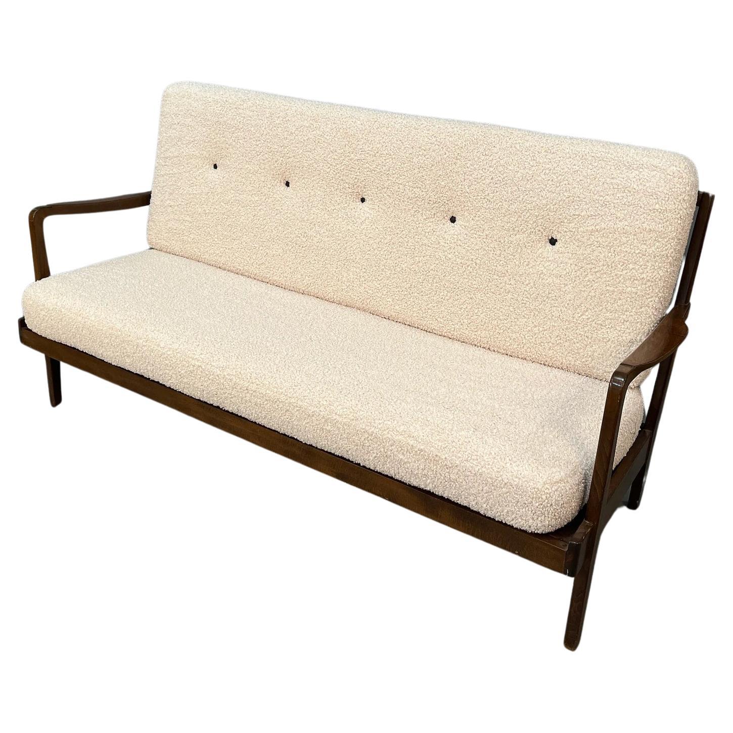 Mid Century curated loveseat sofa with new boucle cushions For Sale