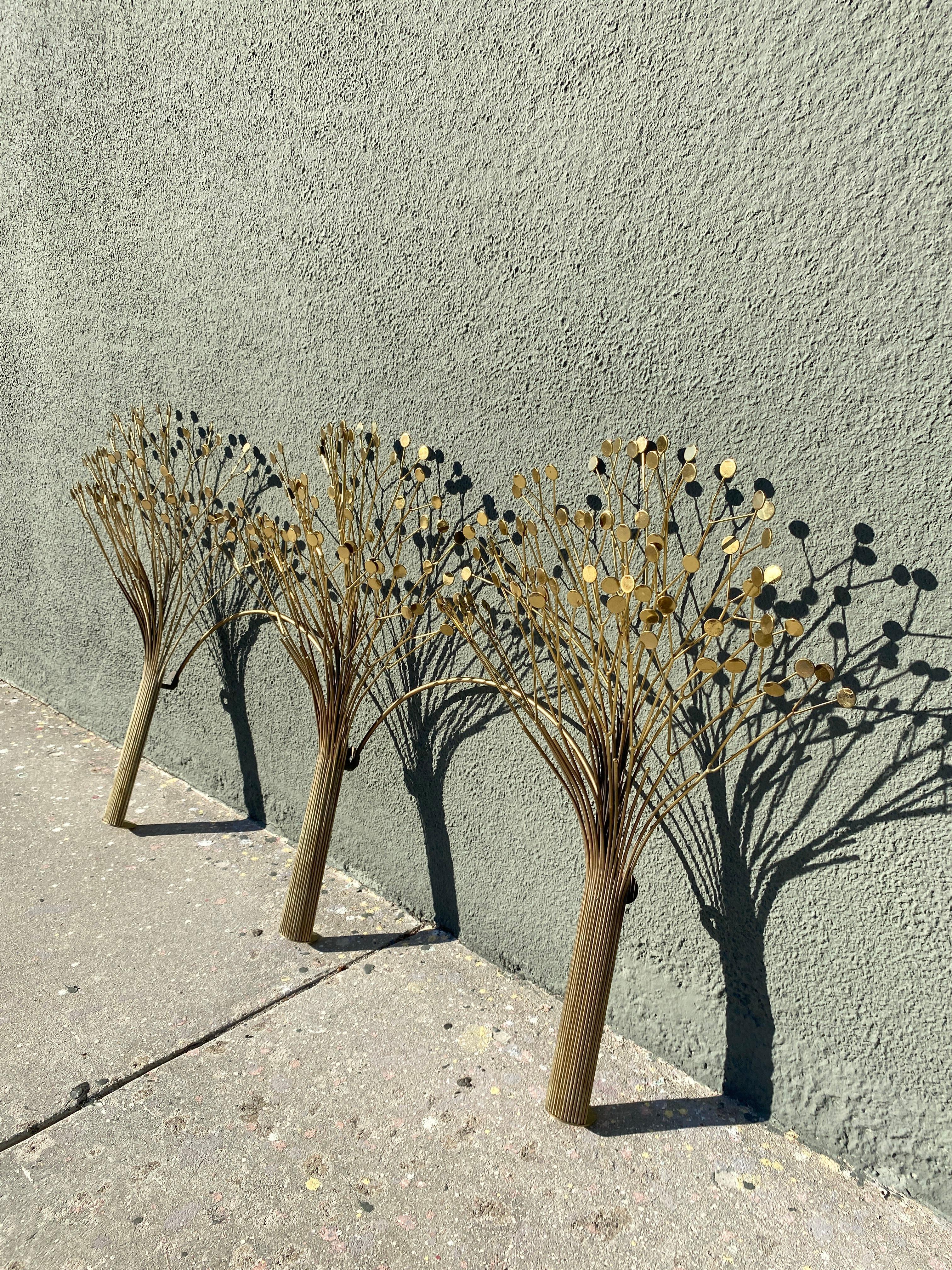 Brass rods make up three trees with teardrop-shaped leaves that shimmer with reflected light. Each ‘tree’ has a wall hook to keep the sculpture very sturdy and straight.

Circa 1970s.

Measures: 34”H x 66”W x 12”D.