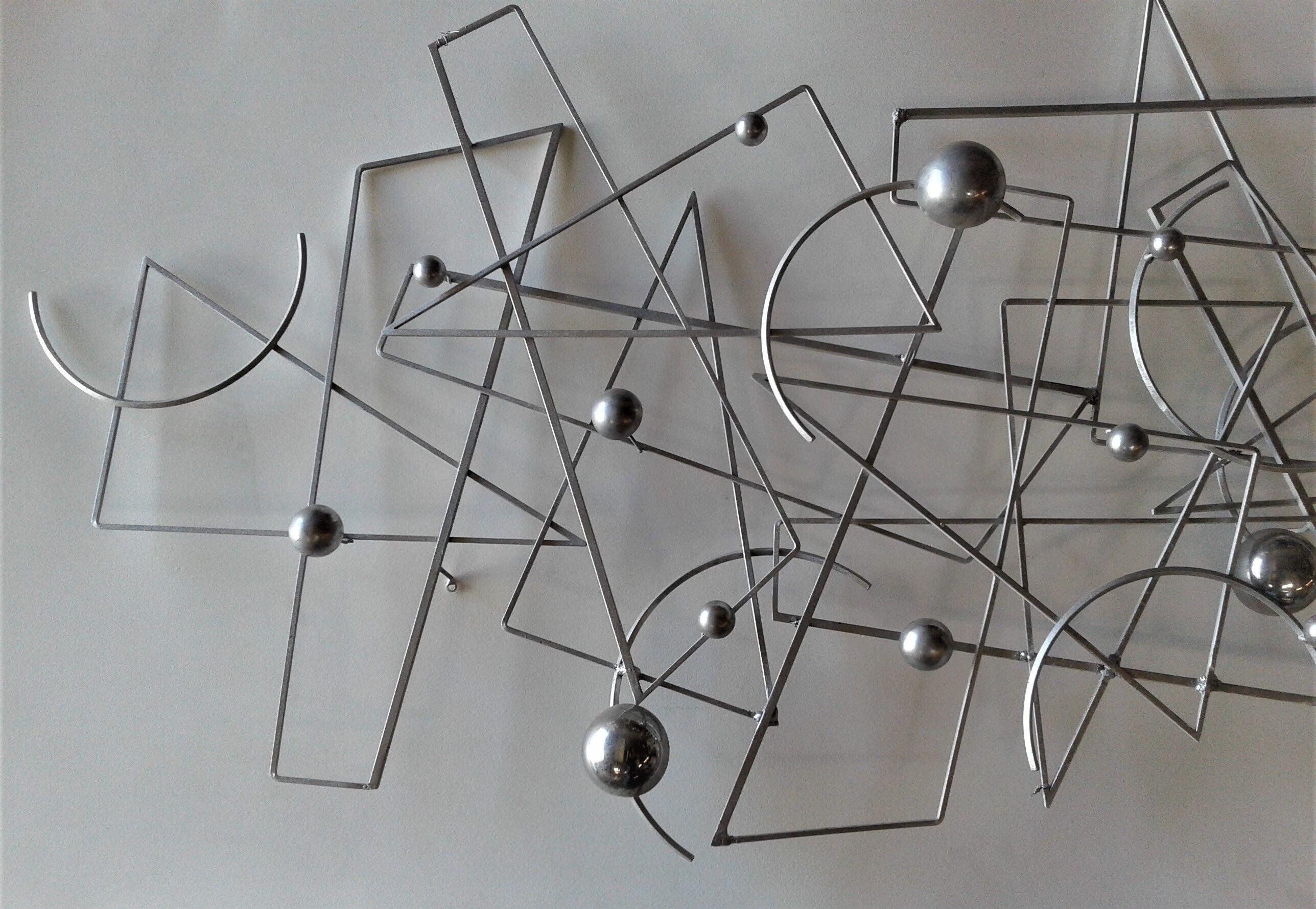 Large wall sculpture in the style of Curtis Jere made of silver faux welded metal. A great addition to modernist wall space in any household.