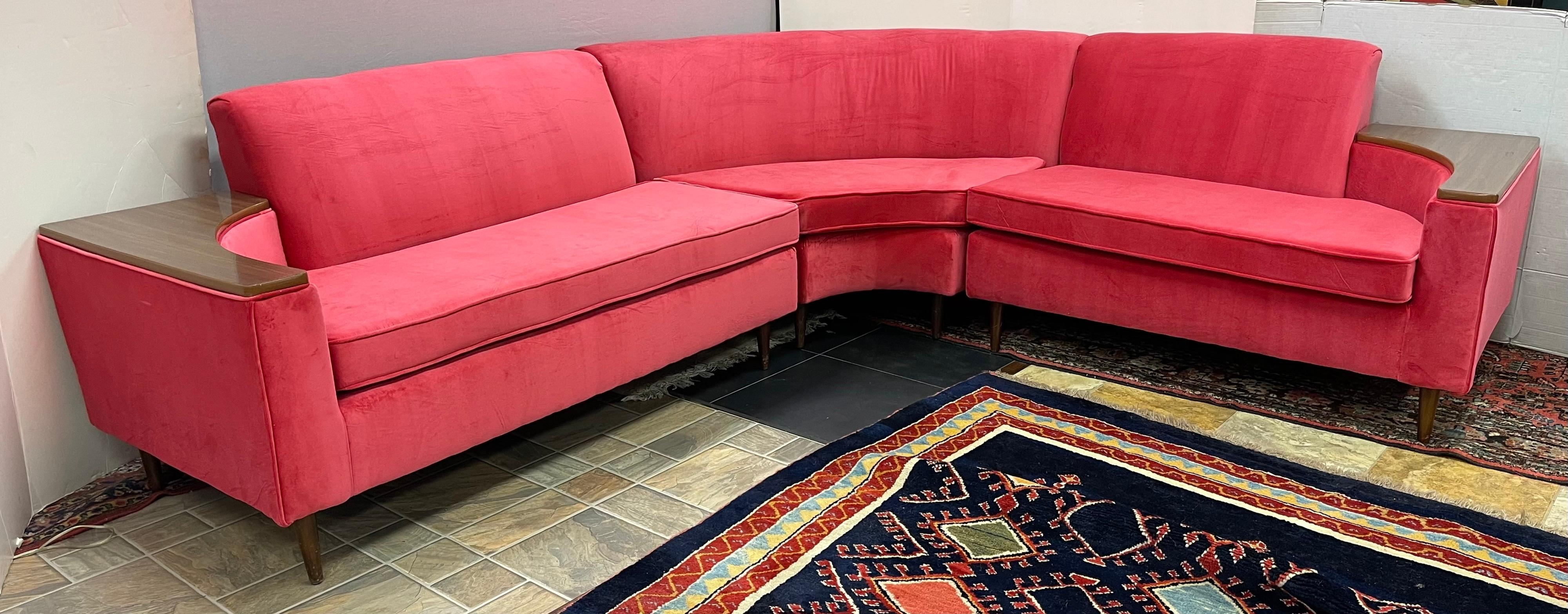 Magnificent Mid-Century Modern three piece sectional sofa with new coral pink velvet upholstery. The dimensions for the entire piece are down below and the three pieces from left to right measure as follows:

-left piece: 58