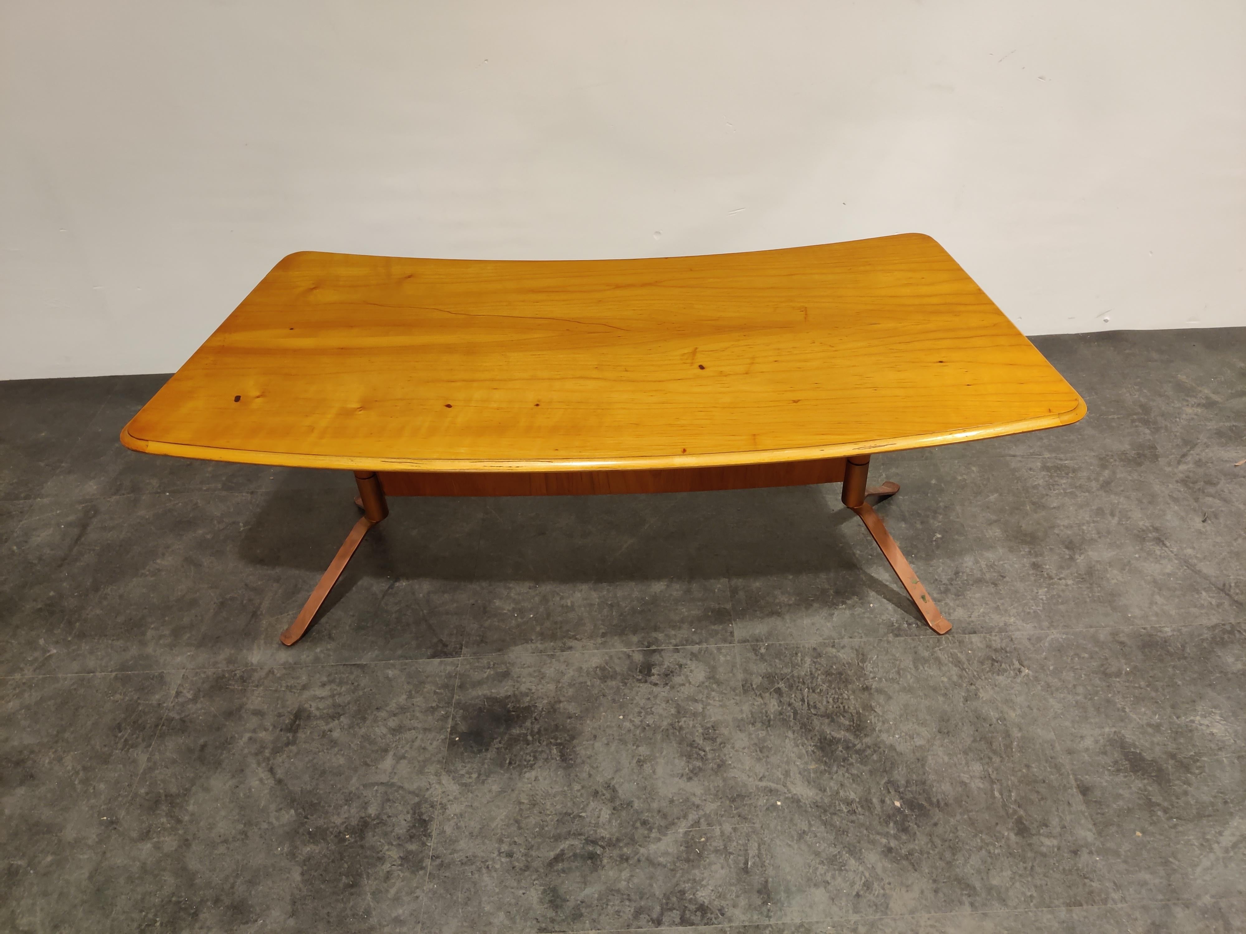 Midcentury curved coffee table made from pine wood and copper legs.

Stamped underneath, but no manufacturer/designer could be linked.

Made in Germany, circa mid-1960s

Good condition.

Dimensions:
Height 50cm/19.68