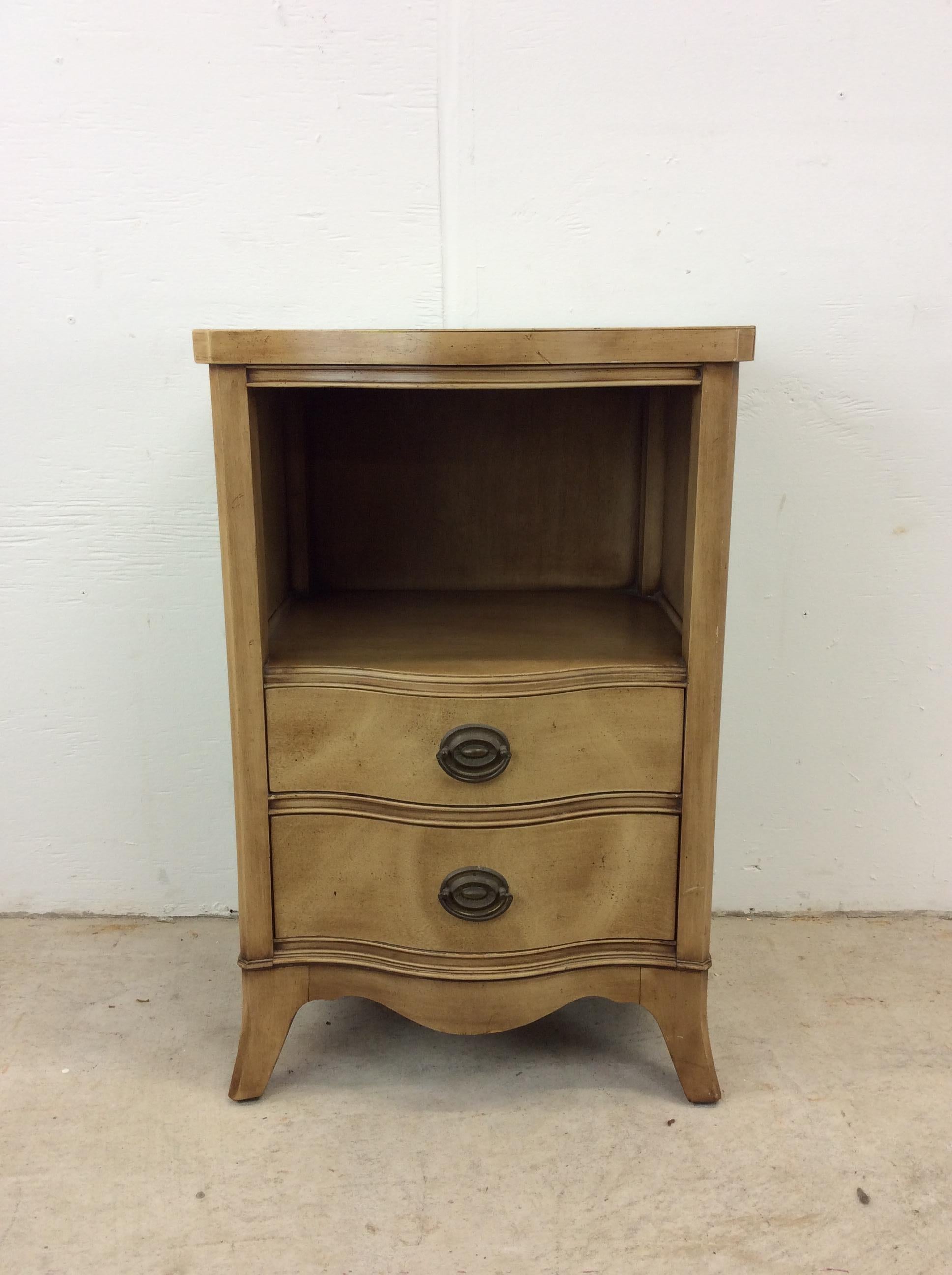 This mid century nightstand by Drexel features hardwood construction, original bleached walnut veneer, two dovetailed drawers with curved fronts and brass hardware, opened storage shelf, and tall tapered legs. 

Matching highboy dresser, lowboy