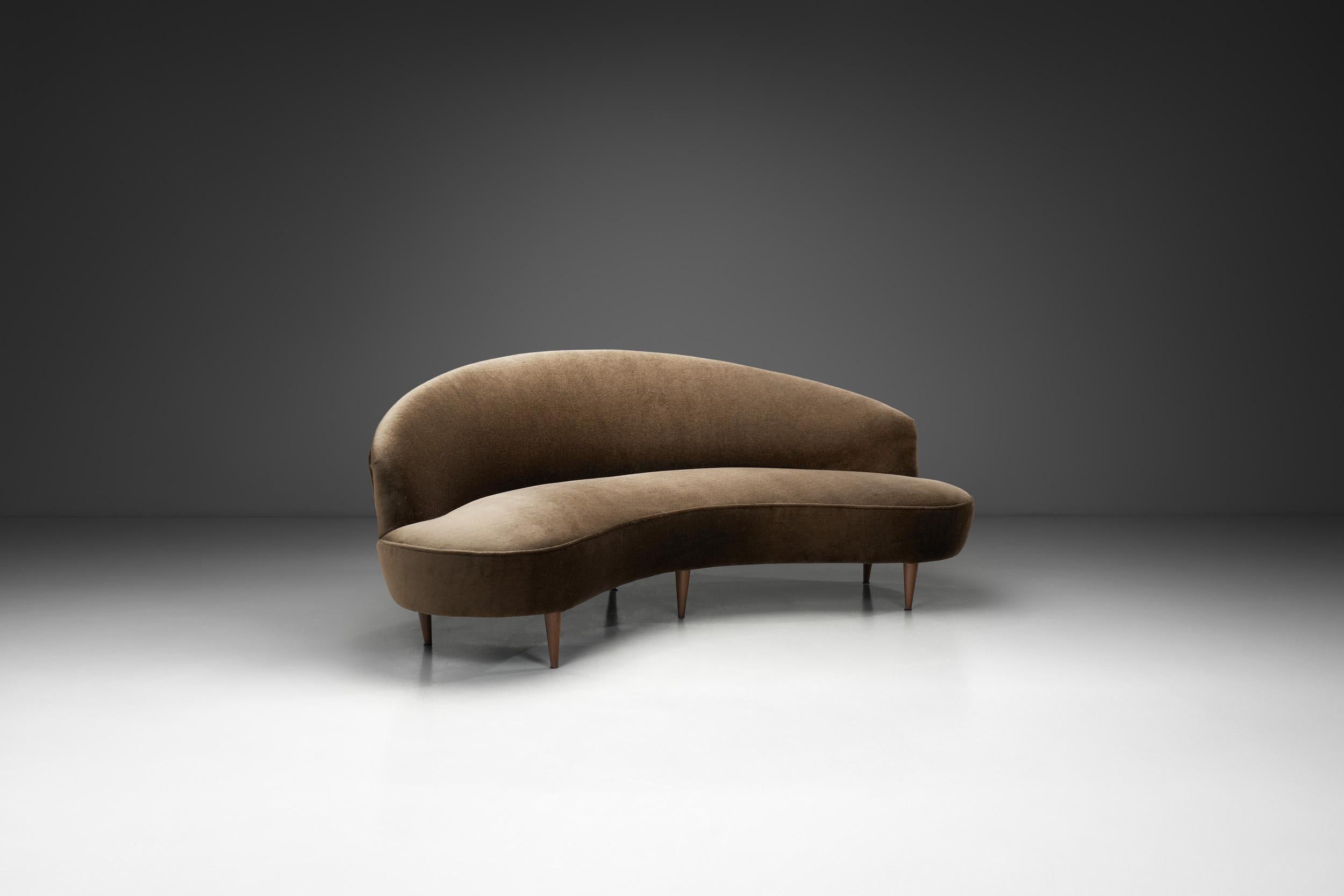 Italian mid-century furniture and interior design is known for its elegantly organic forms. The era’s seating models - including this sofa - were created to highlight the spirit of rebirth of post-war furniture design characterised by clean lines