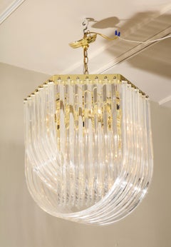 Midcentury Curved Lucite Ribbon Chandelier in Brass