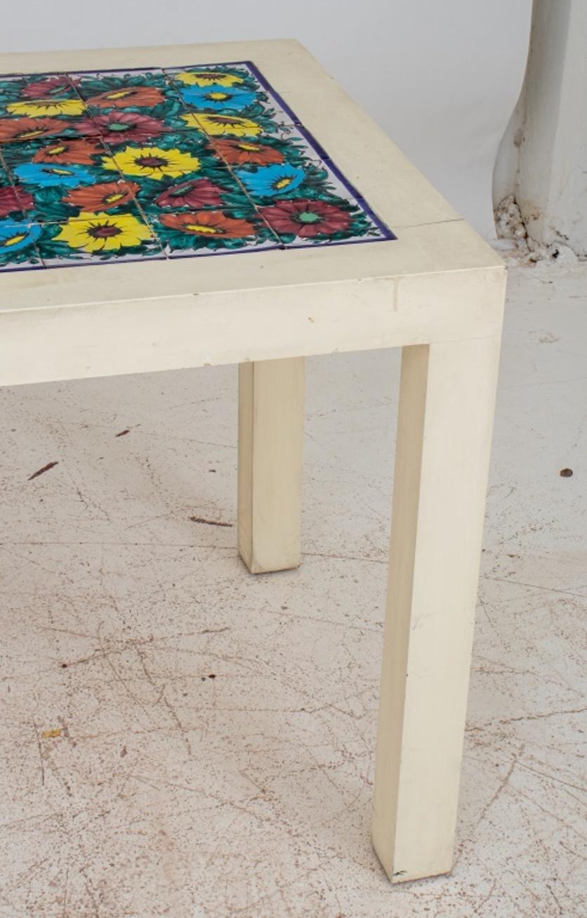 Mid-Century custom parsons table / desk, ca. 1960s or later, of typical Parsons form, with Mexican tile inset to one side, allover lacquered in white. 29