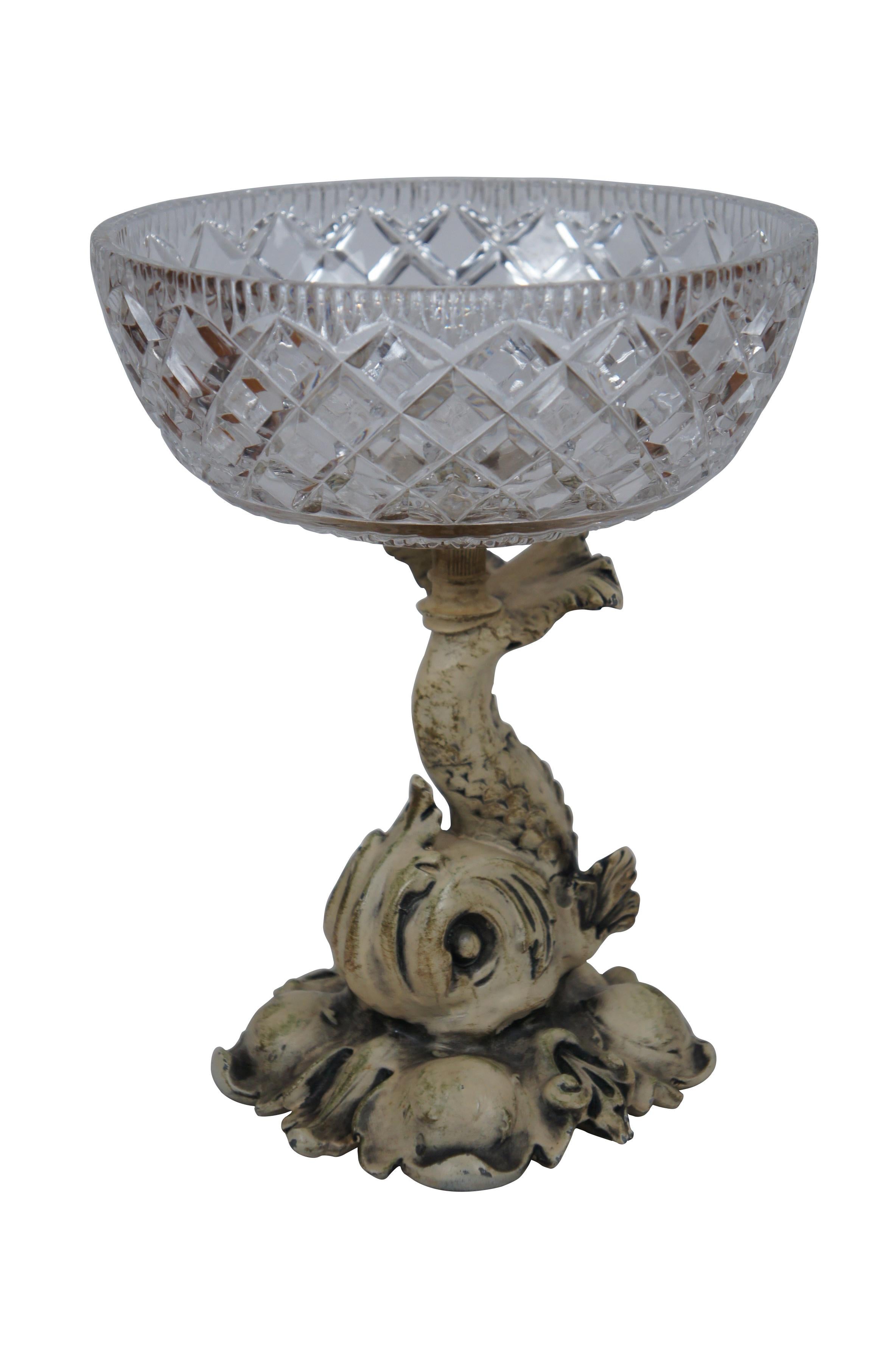 Pair of rare mid 20th century French Empire / Neoclassical compote bowls featuring cast metal pedestal bases in the shape of delphins / dolphins / fish, painted in off white, balancing cross cut crystal bowls on the tops of their tails.  Base