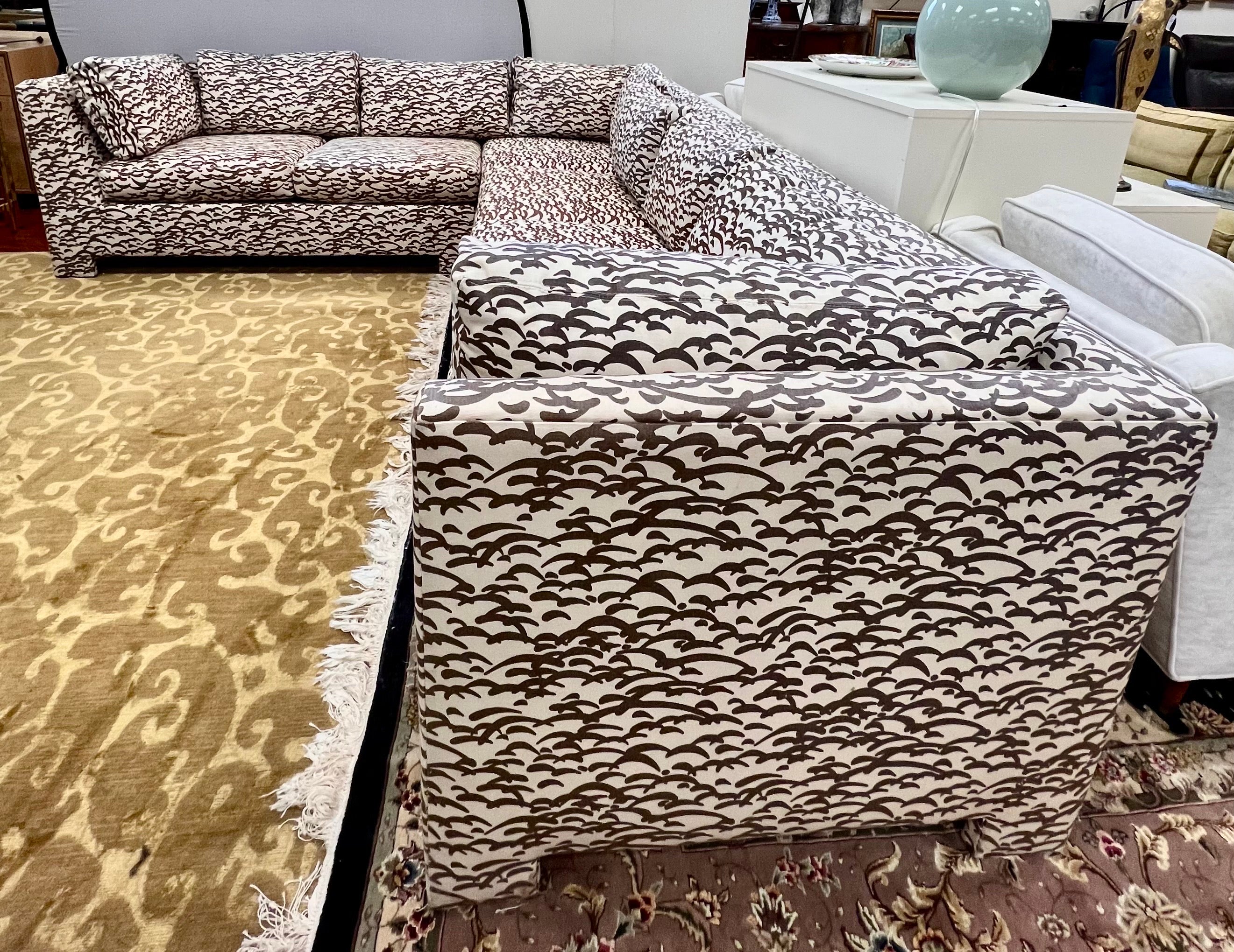 Stunning 2 pc mid century sectional sofa designed by Cy Mann upholstered in a brown and cream abstract print fabric. Retains its original fabric with no tears or rips but is slightly faded in places.
Measurements from back corner to left arm
