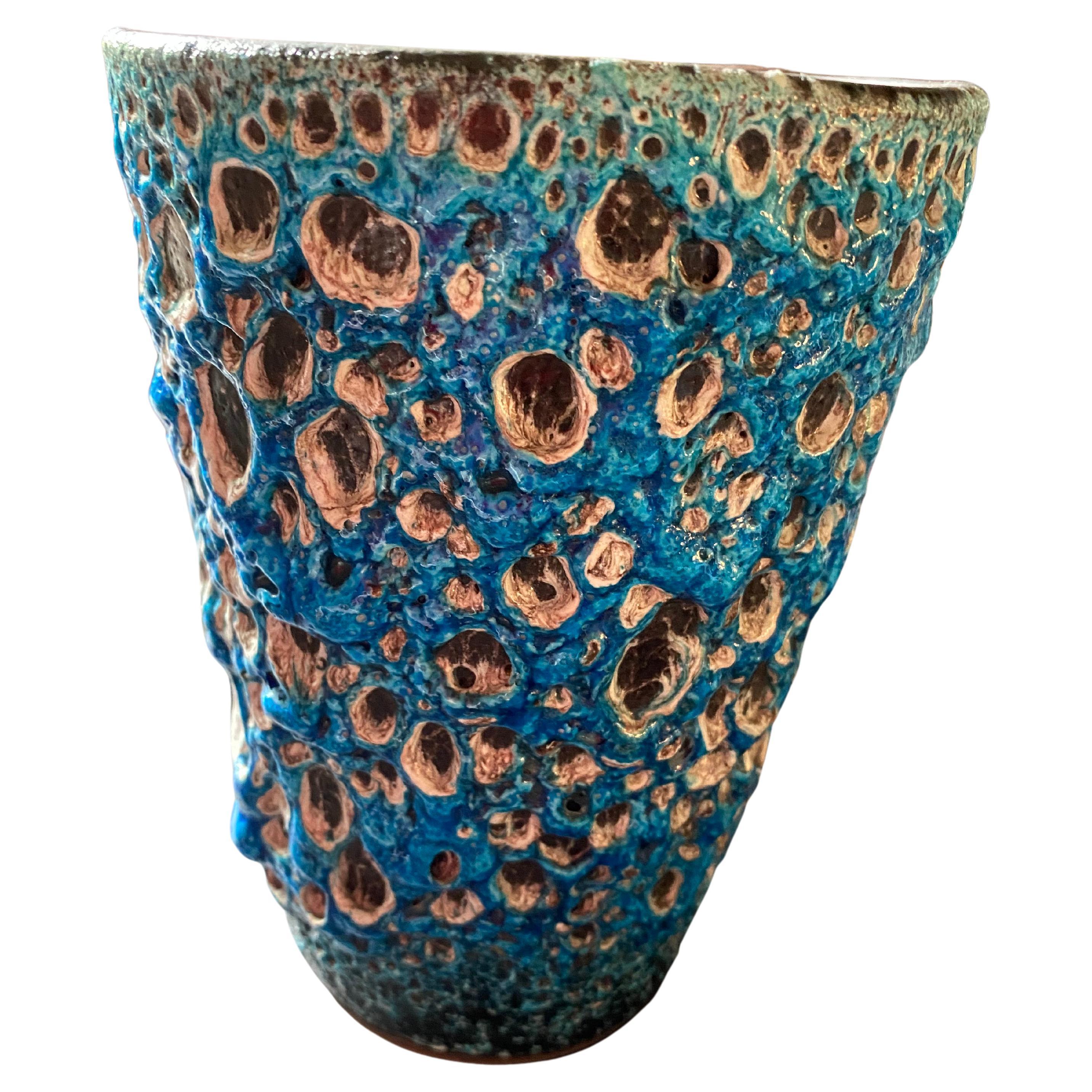 A beautiful blue glazed lava vase by the well-known artist Charles Cart. From the French Le Cyclope in Annecy, Charles Cart is designer of Emaux des Glacier.
