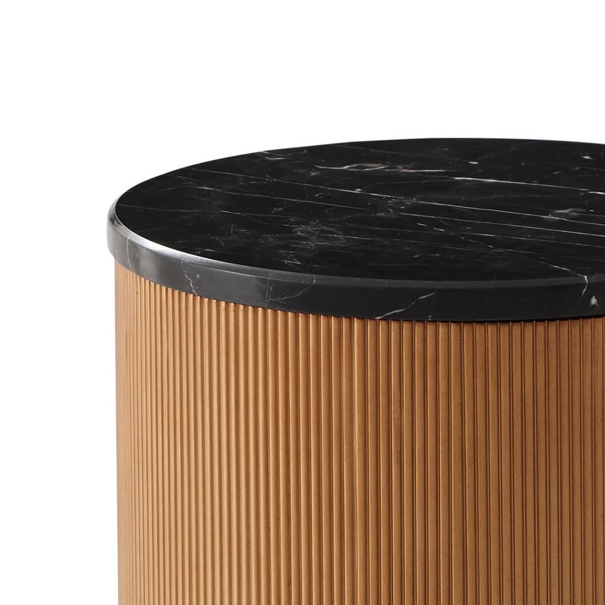 A cylindrical form round Nero Marquina marble top accent table with a reeded frame.

Dimensions: 14.5