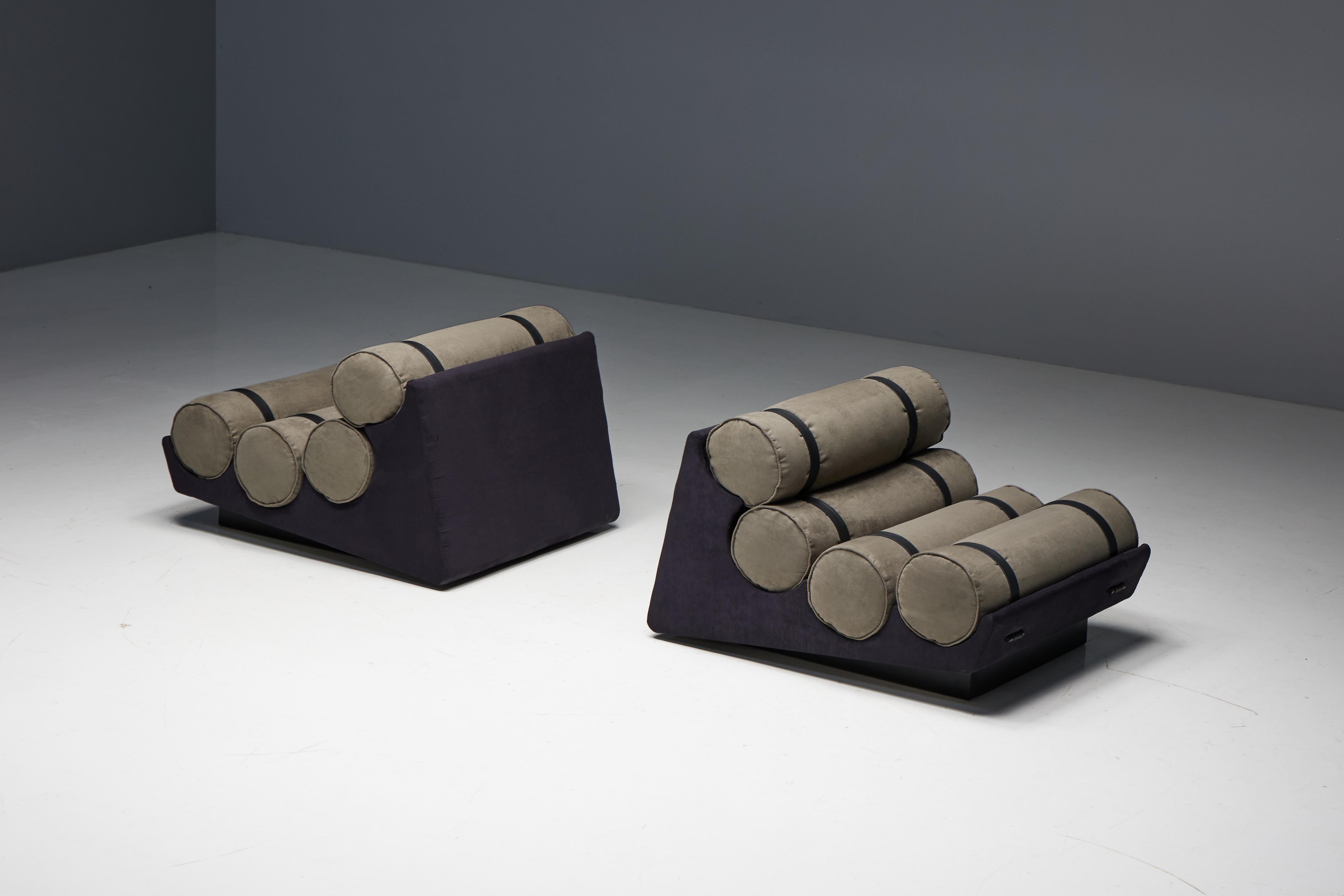 Mid-century cylindrical armchairs, designed in Brazil circa 1970 by an unknown designer. Each armchair features a unique hammock-like structure of connected wooden slats, supporting four loose roll cushions secured by black natural leather straps